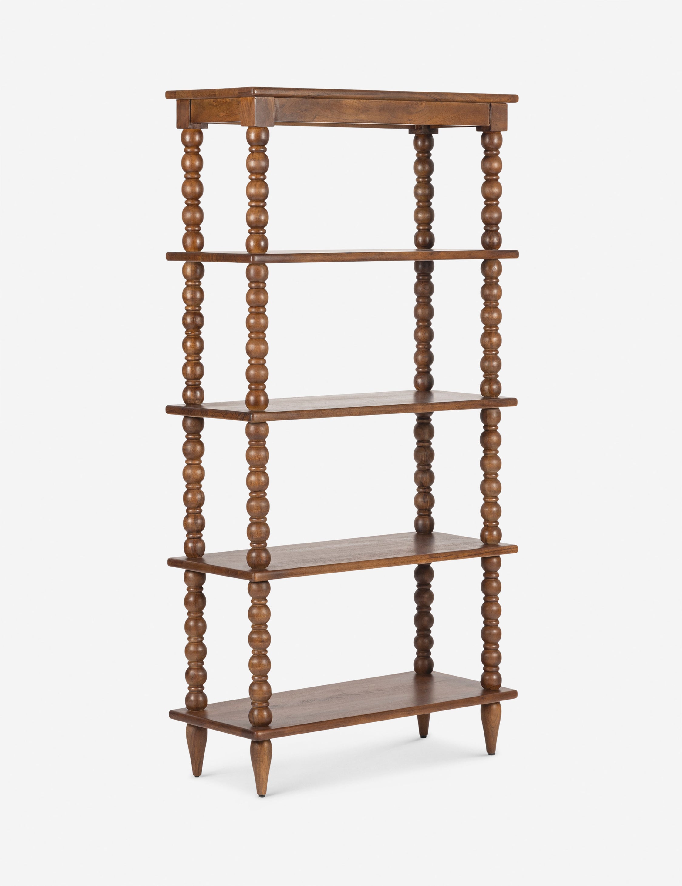 Angled view of the Foxton beaded turned wood tall bookcase