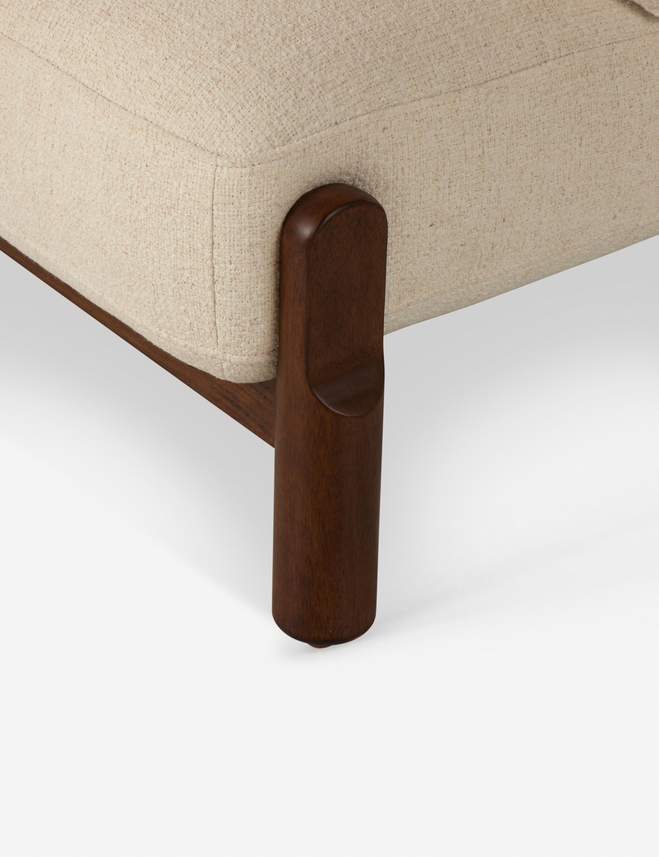 Close up view of the Furst sculptural upholstered barrel back accent chair in ivory.