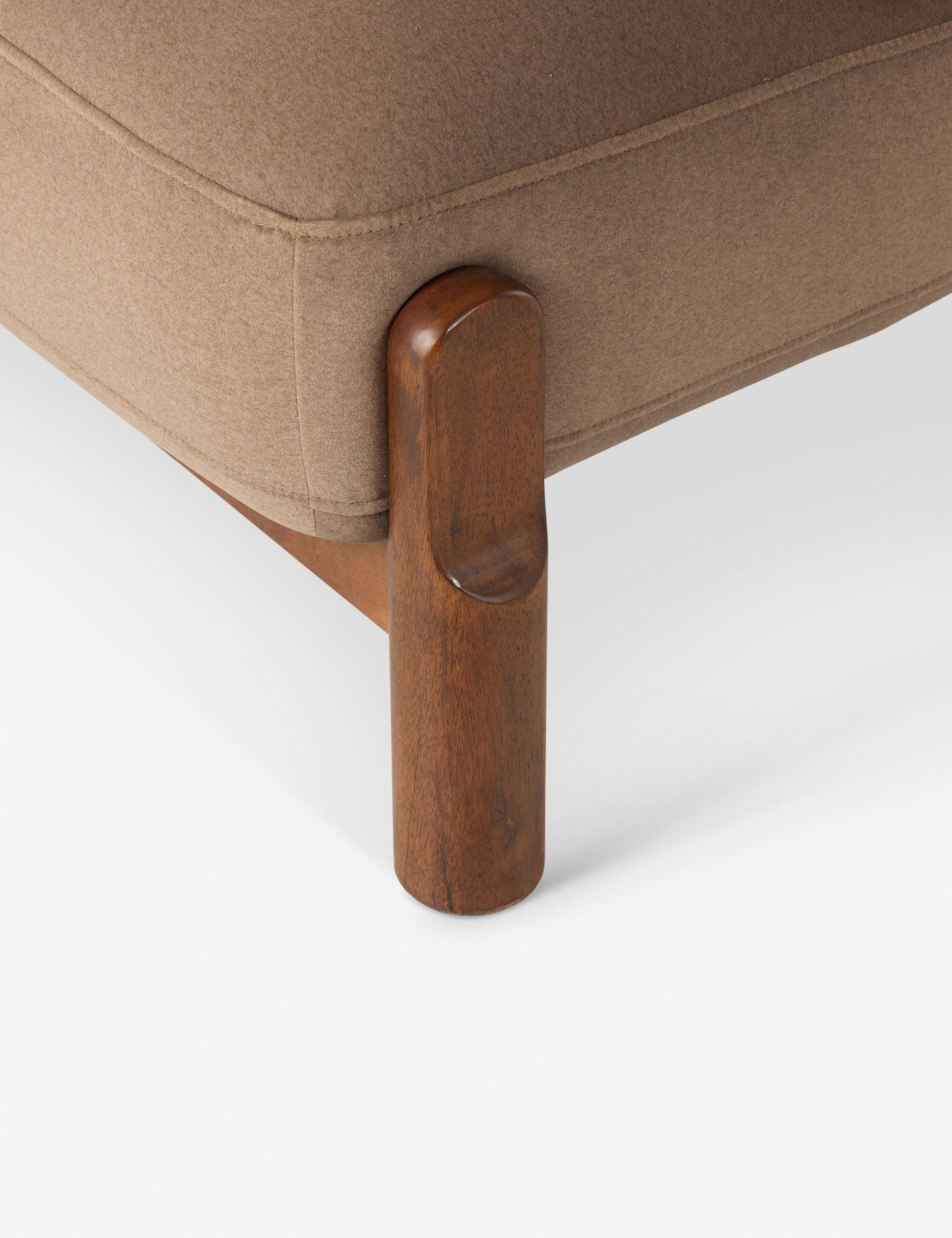 Close up view of the Furst sculptural upholstered barrel back accent chair in taupe velvet.
