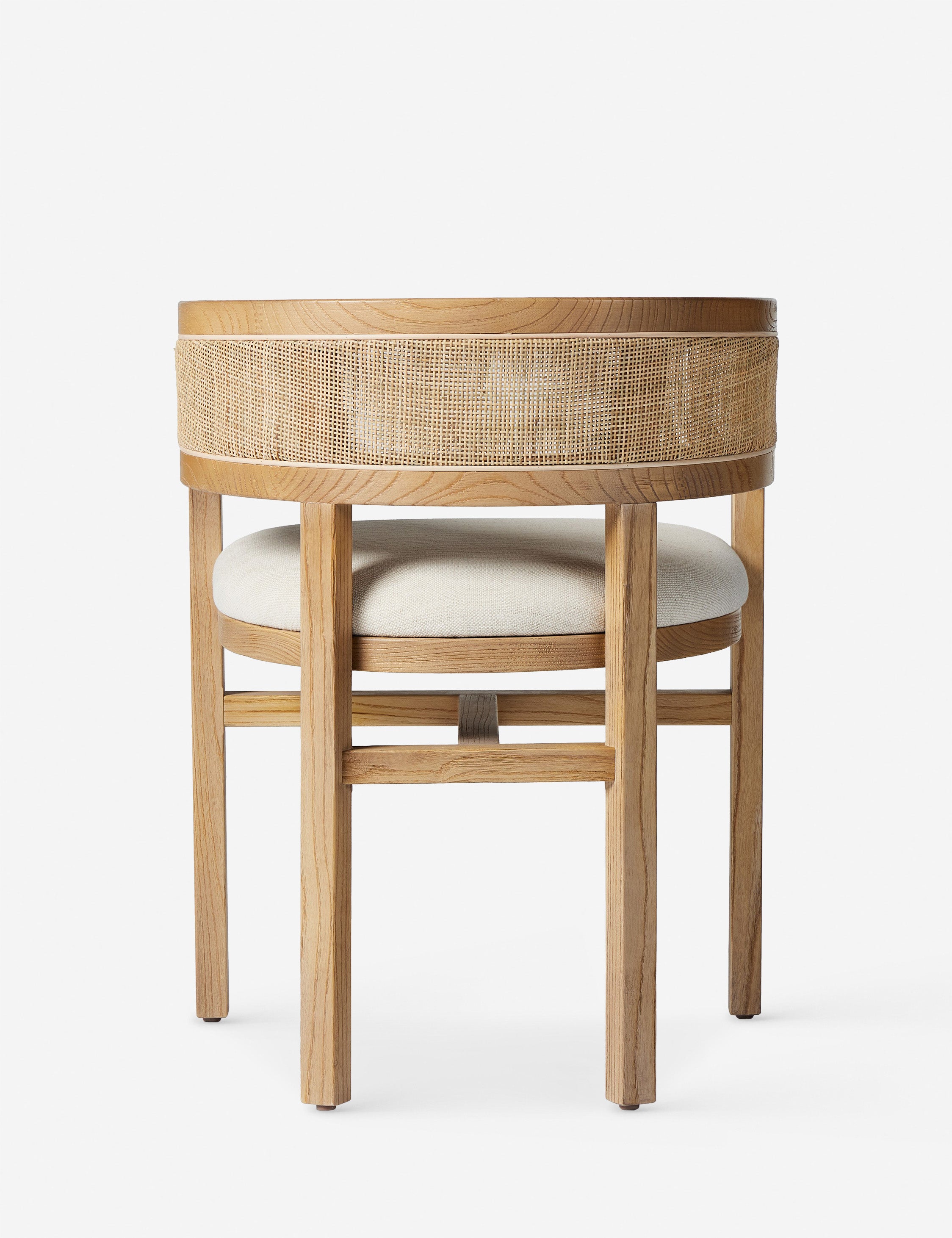Back of the Kairi light wood cane barrel back dining chair.