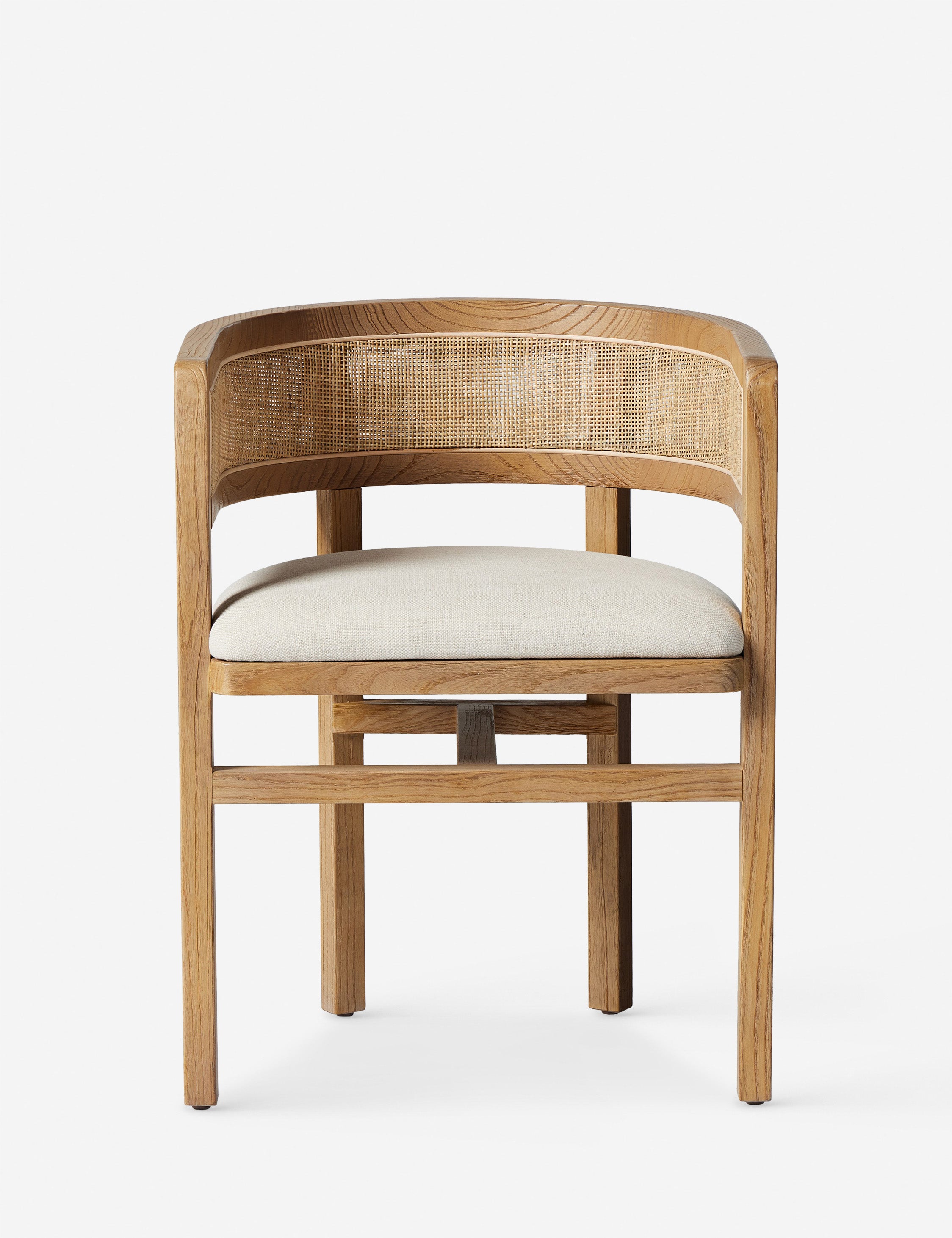 Kairi light wood cane barrel back dining chair.
