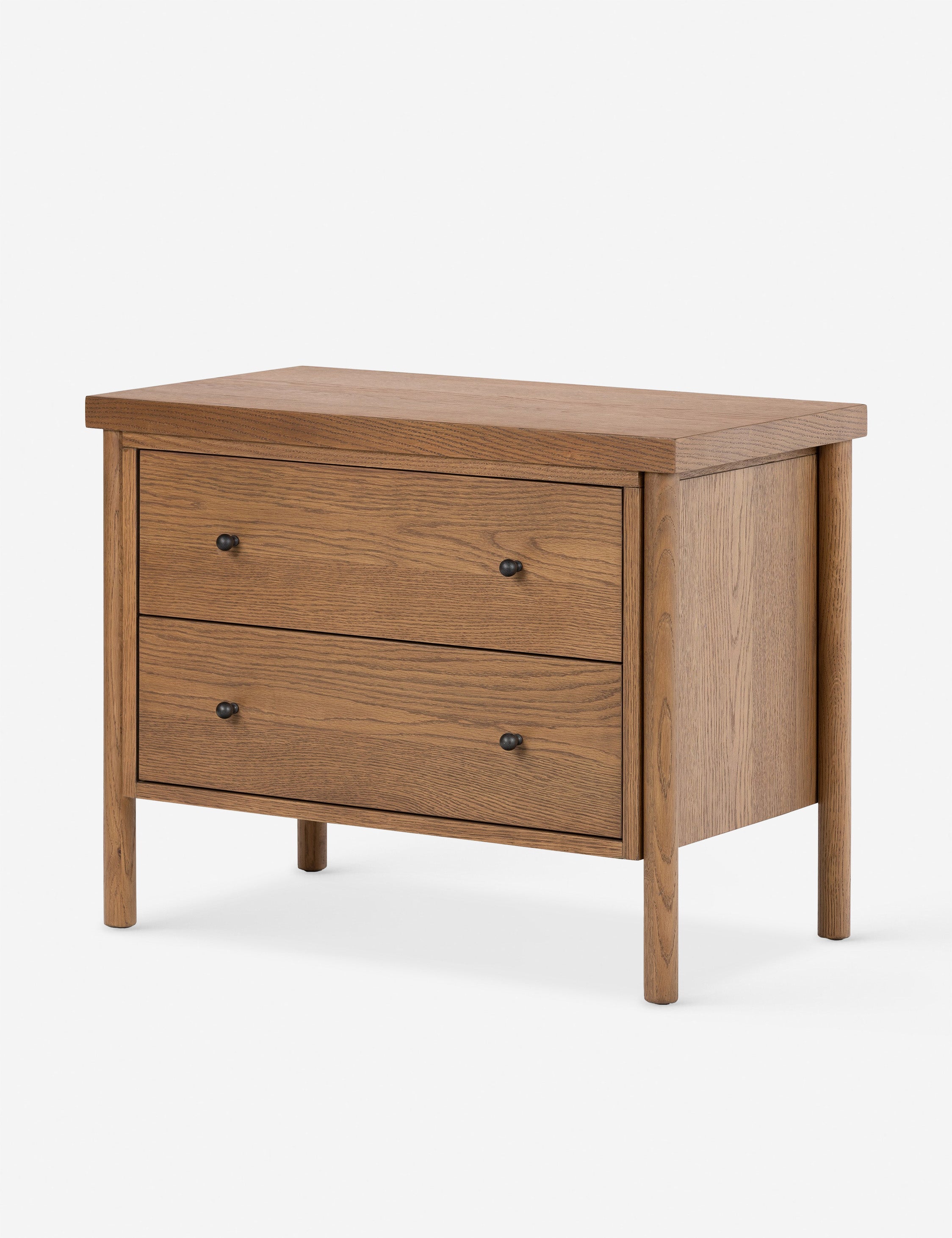 Angled view of the Kisner natural grain oak nightstand.