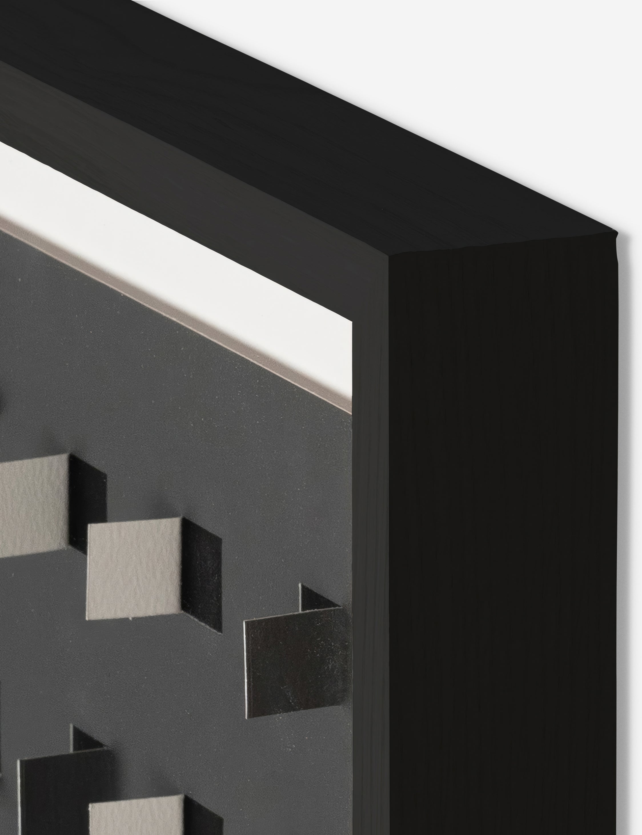 Corner of the See through small charcoal gray and black wall art