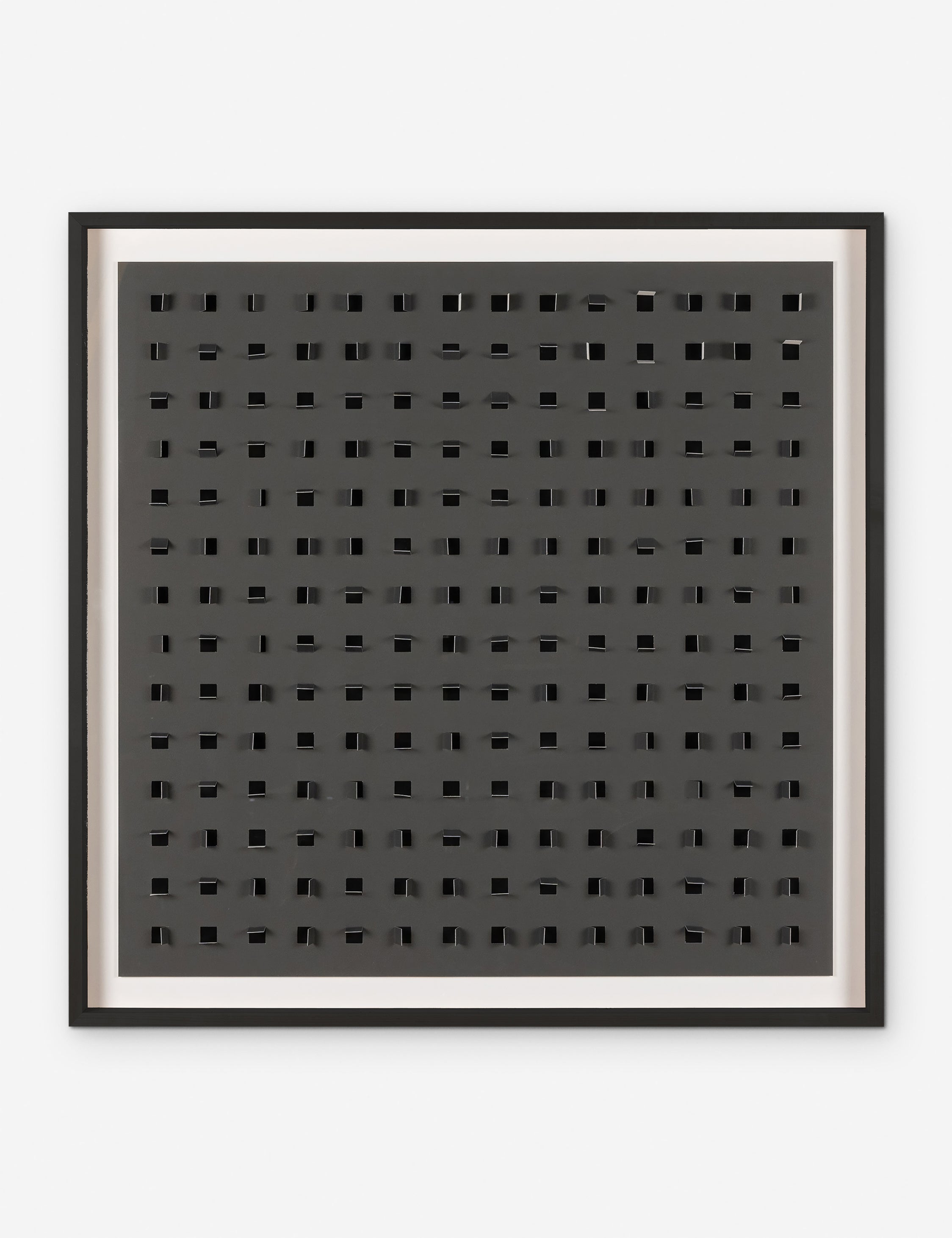 See Through charcoal gray and black wall art featuring square paper cutouts with flaps on a linen backdrop