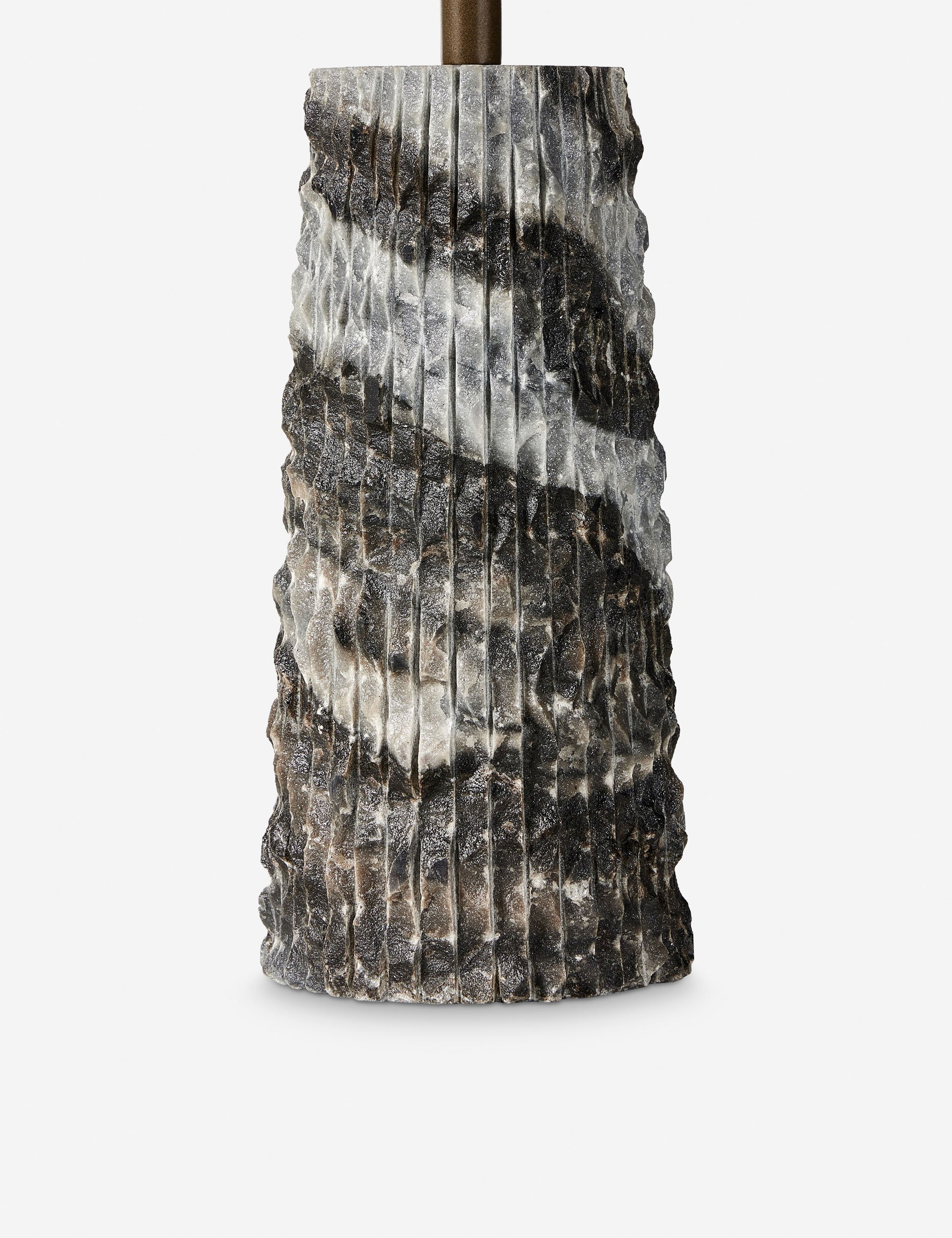 Ribbed base of the Fallow round marble side table.