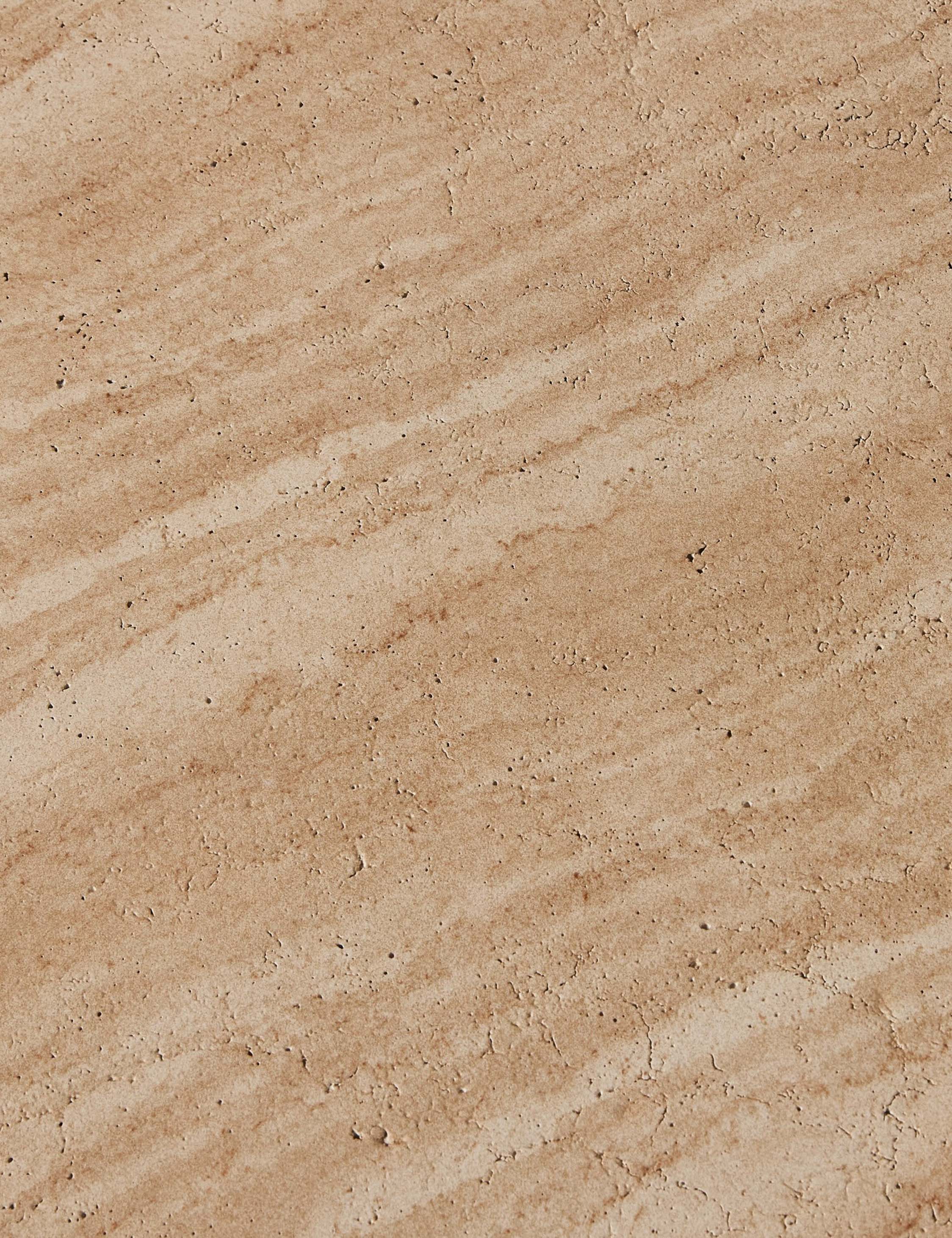 Close up of the stone of the Vinci round stone sculptural coffee table.