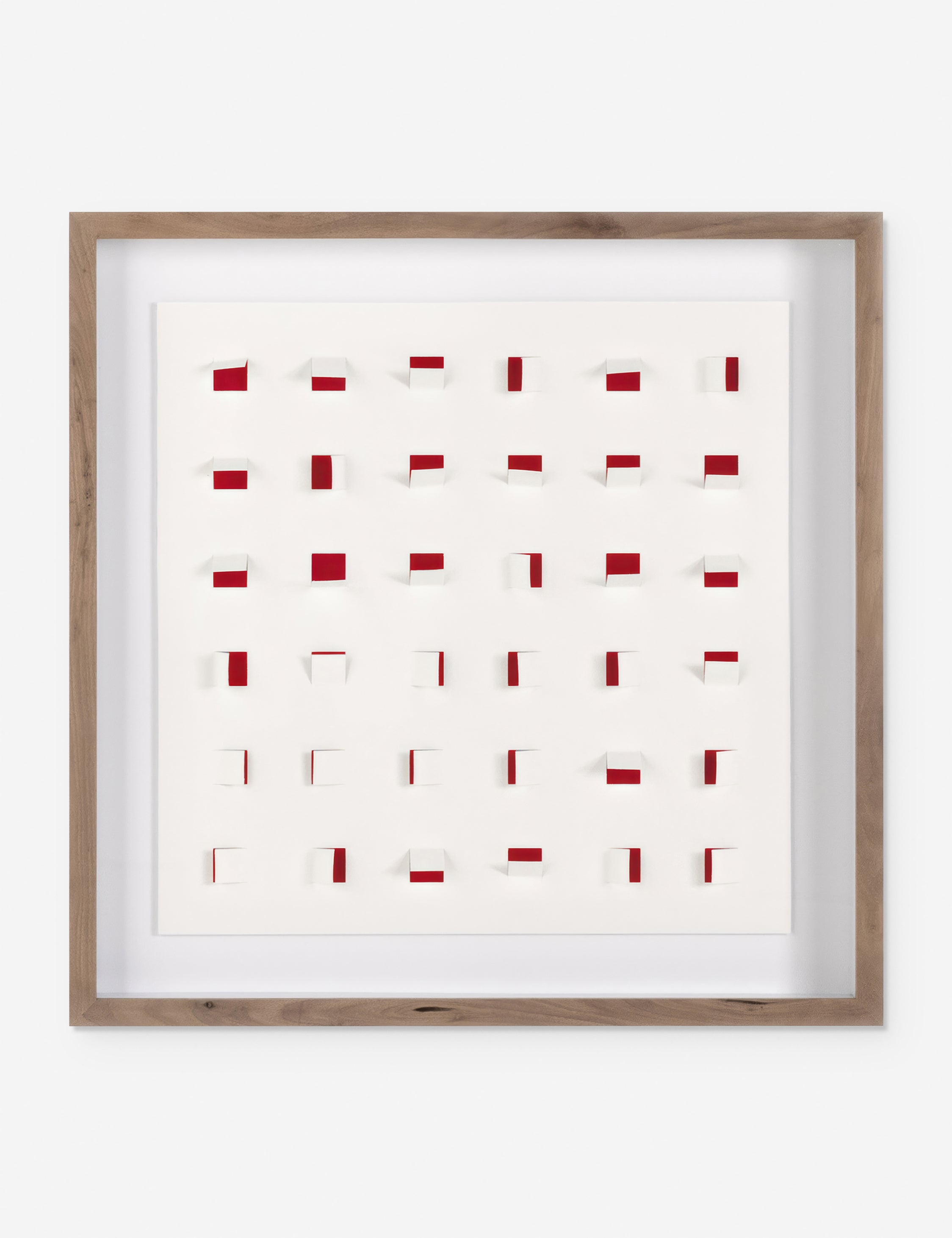 See Through small cherry red and white wall art featuring square paper cutouts with flaps on a linen backdrop