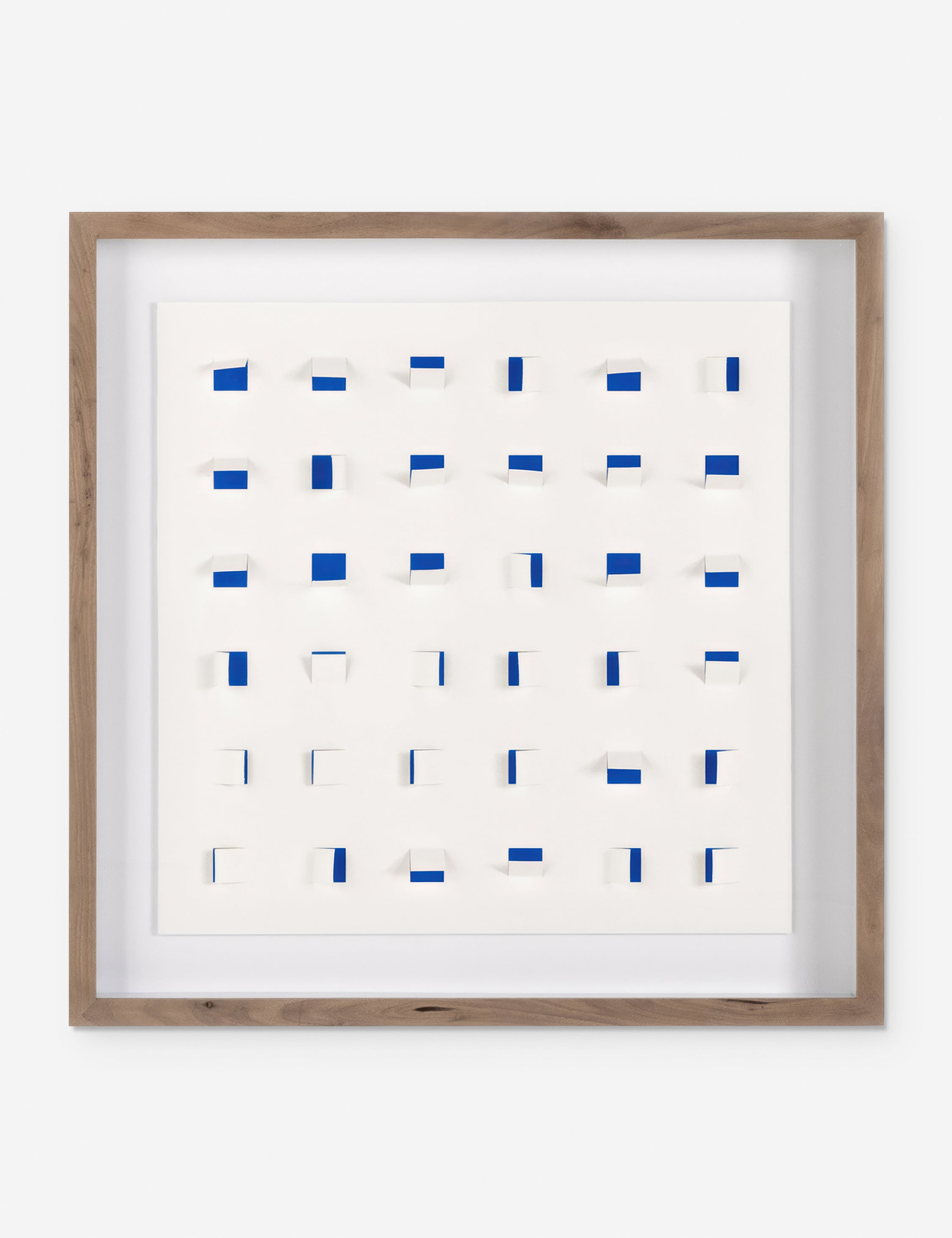 See Through small navy and white wall art featuring square paper cutouts with flaps on a linen backdrop