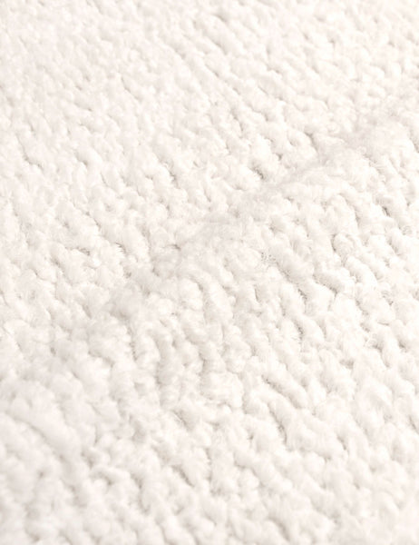 #color::cream-sherpa #size::cal-king #size::full #size::king #size::queen #size::twin | Detailed shot of the boucle fabric on the Adara cream sherpa upholstered bed.