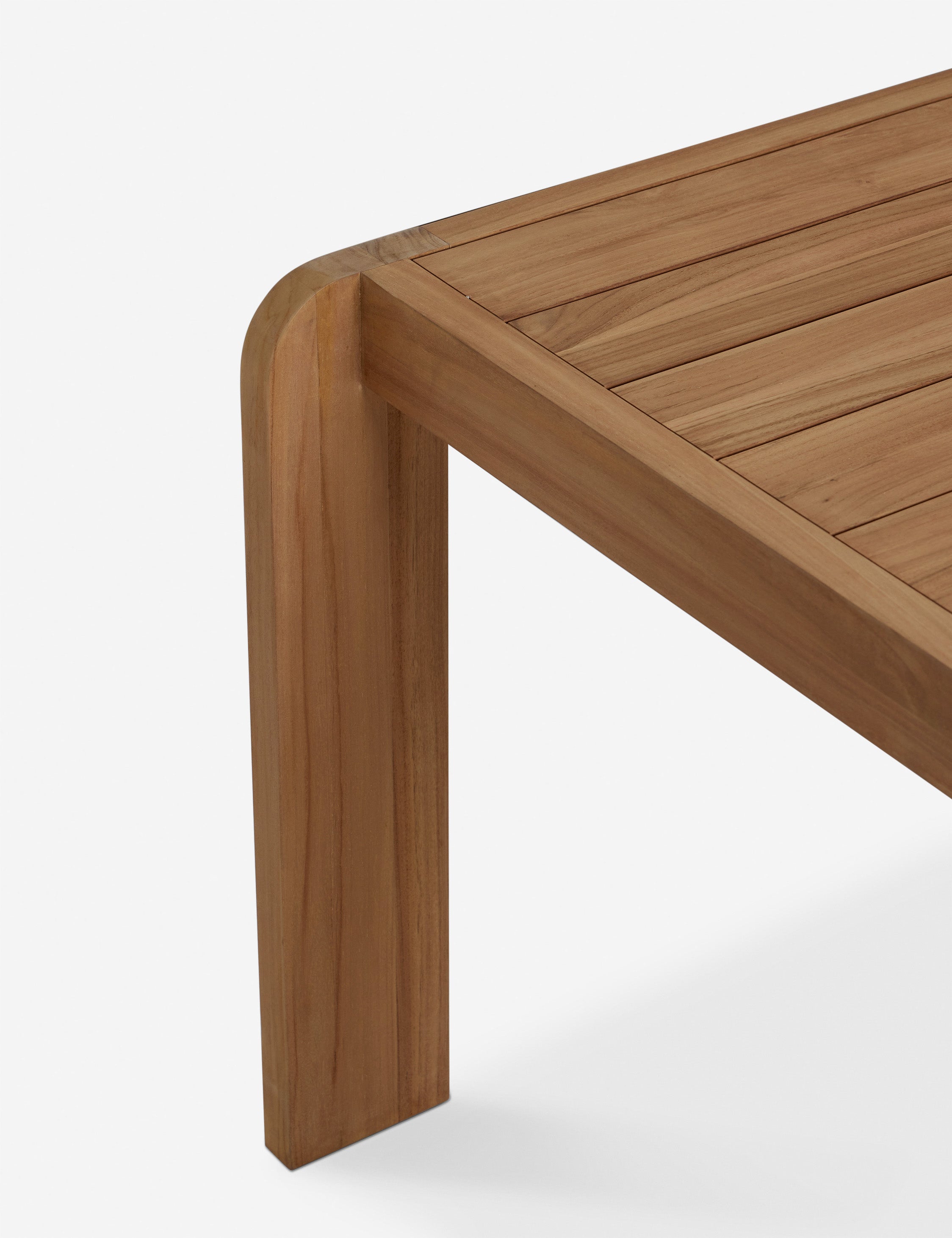 Corner of the Abbot solid teak rectangular outdoor dining table by Sarah Sherman Samuel.