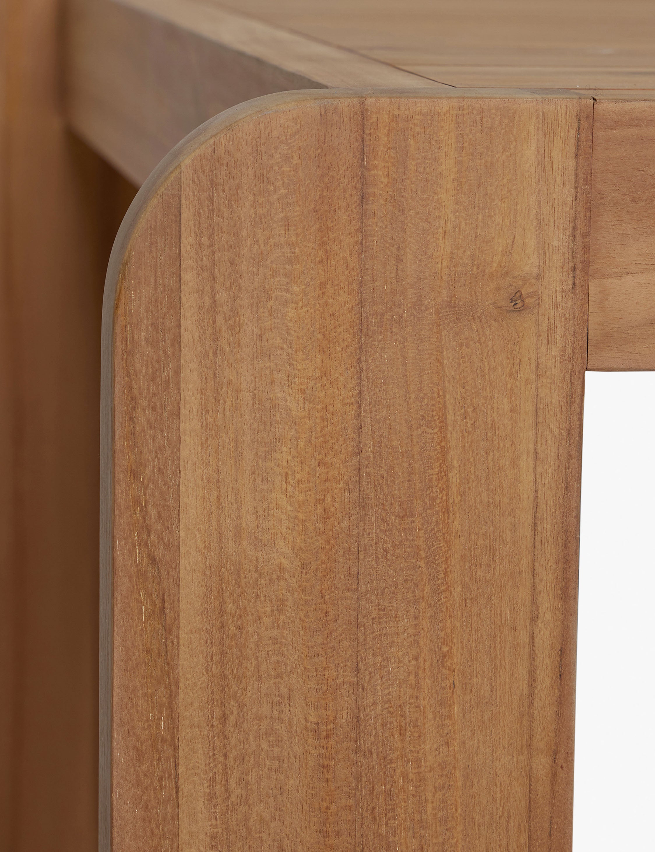 Close up view of the Abbot solid teak rectangular outdoor dining table by Sarah Sherman Samuel.