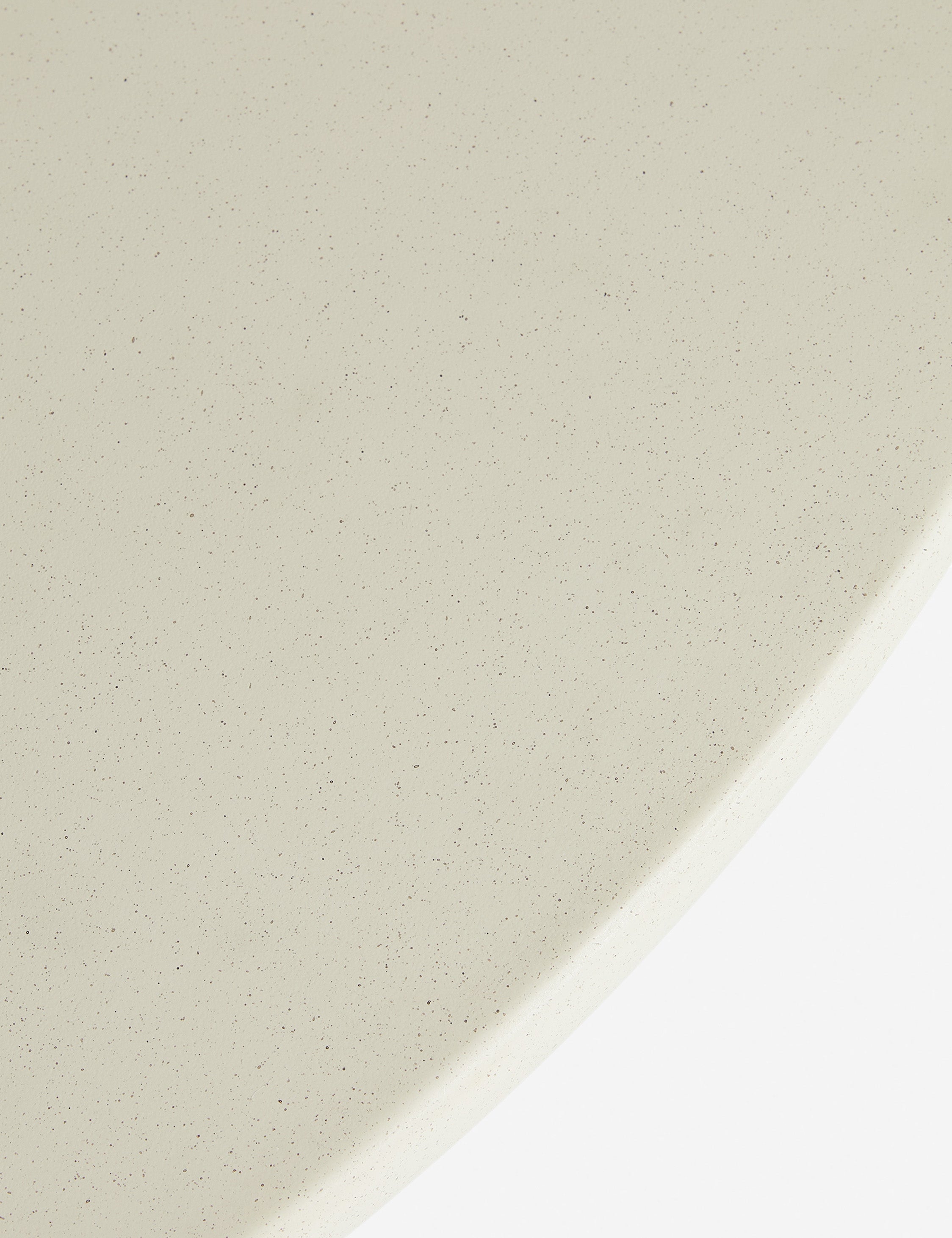 Close up of the Amaya round sculptural cement coffee table.