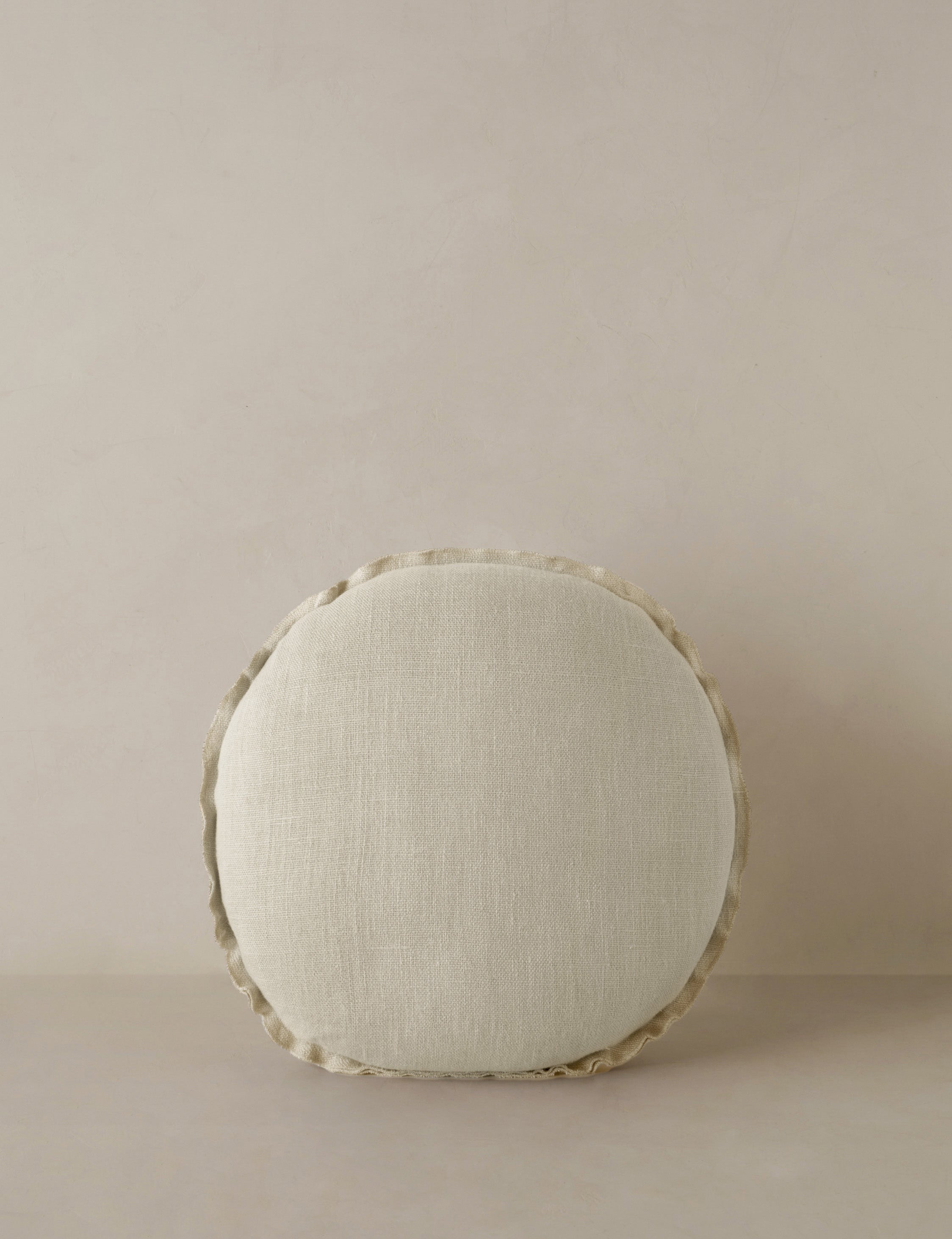 Arlo linen flange trim round pillow.