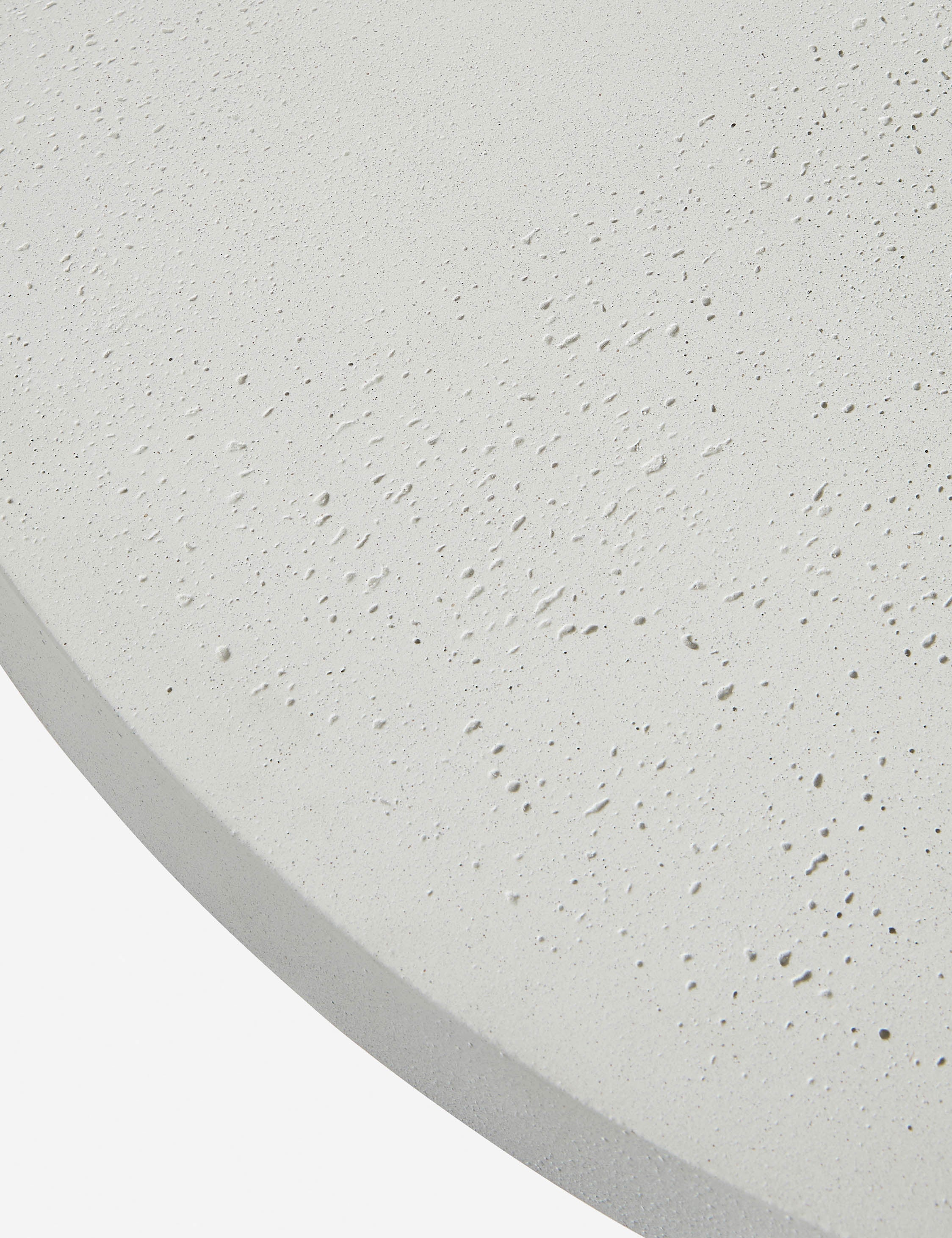 Close up of the top of the Avila modern round pedestal dining table.