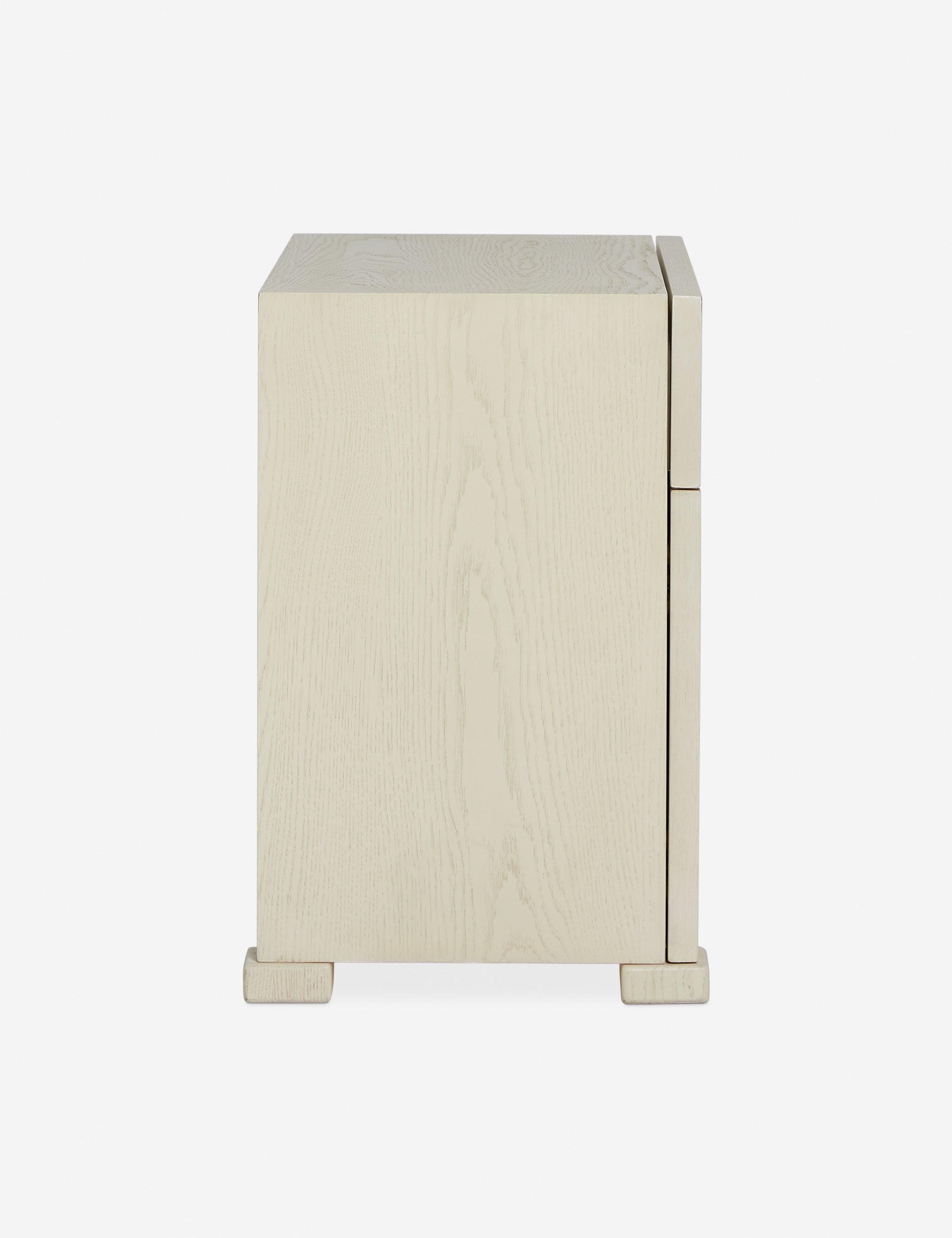 Side profile of the Back of the Beck grooved light wood nightstand.