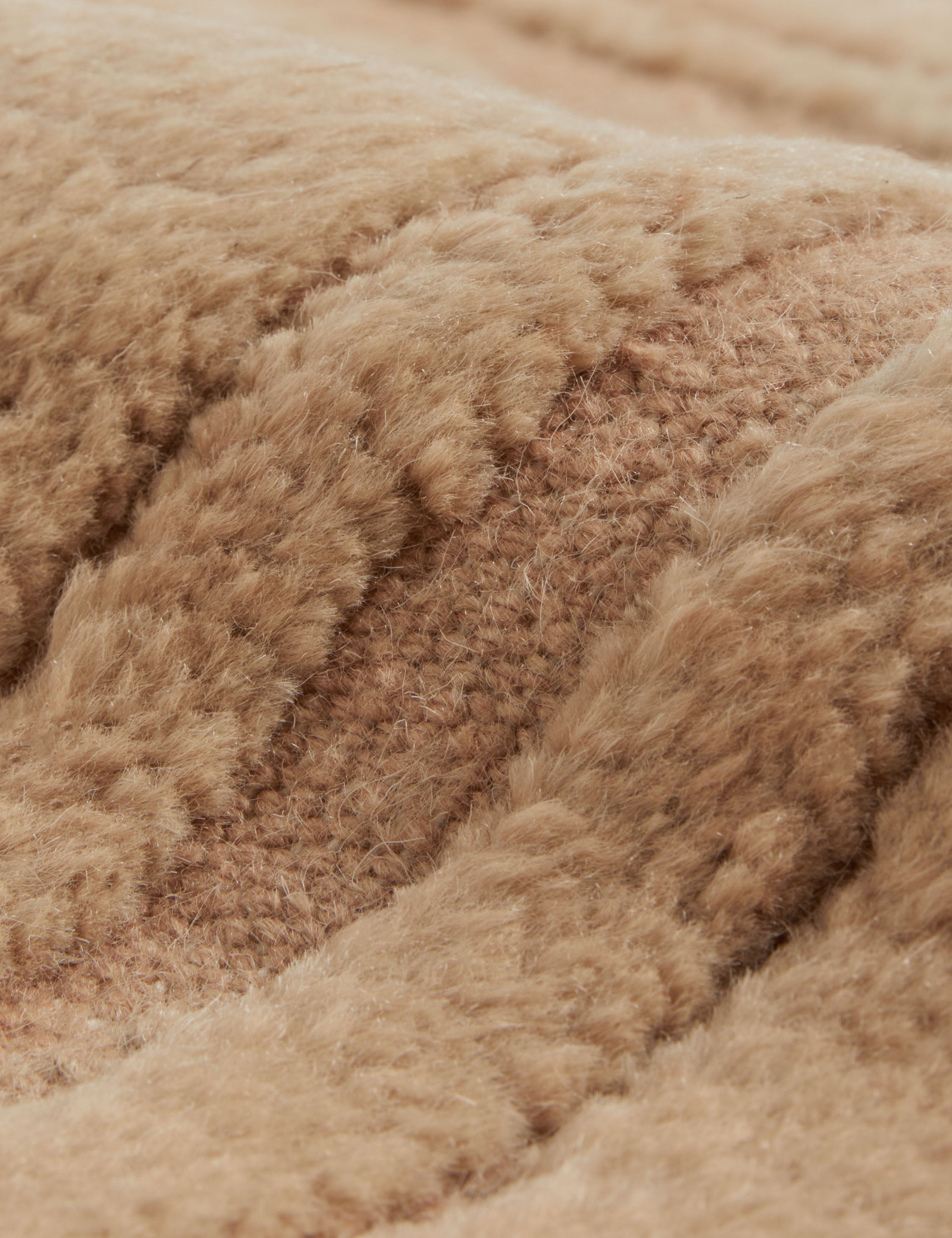 Close up of the Bosa abstract design hand-knotted wool rug.