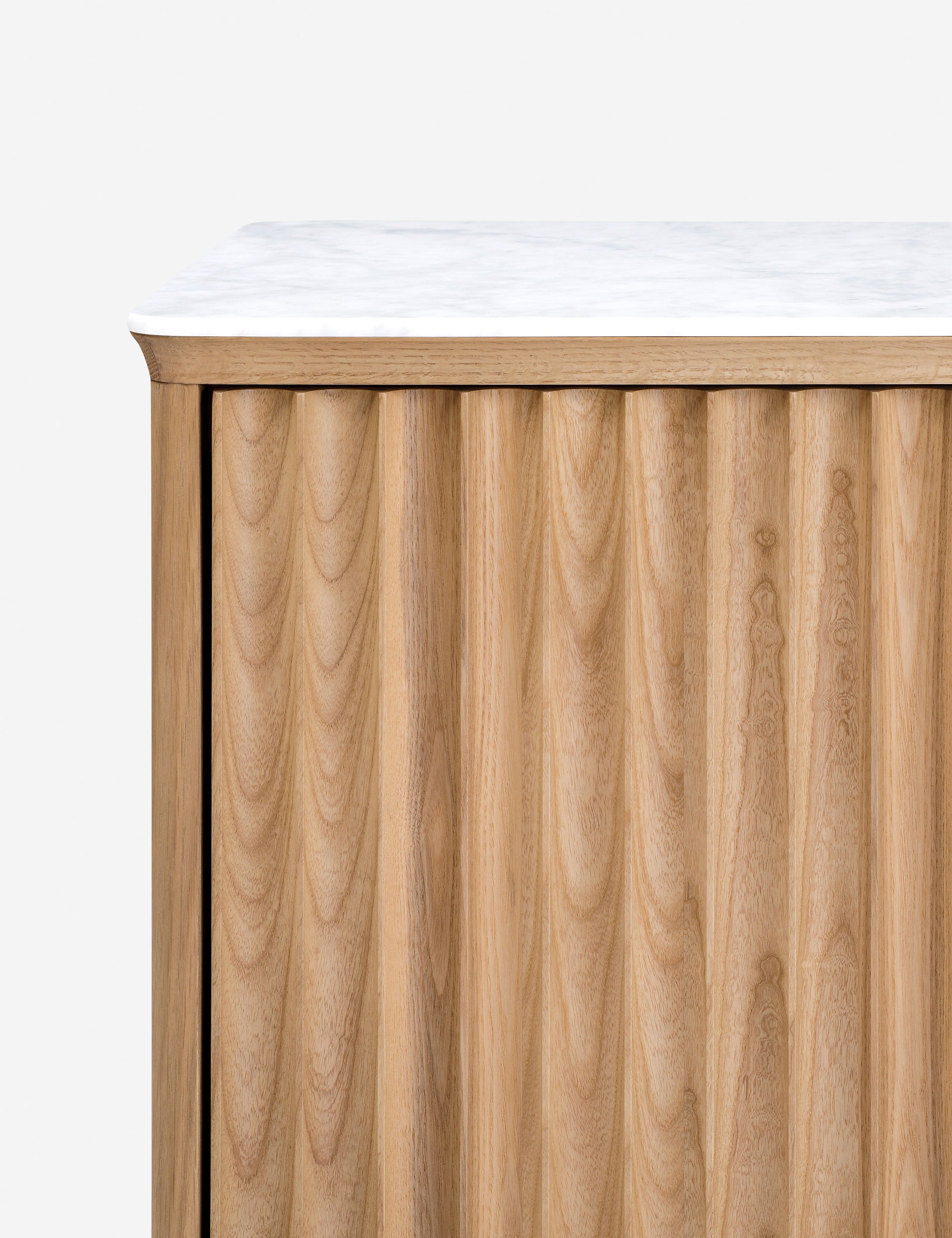 Close up of the Matija marble top, reeded door media console
