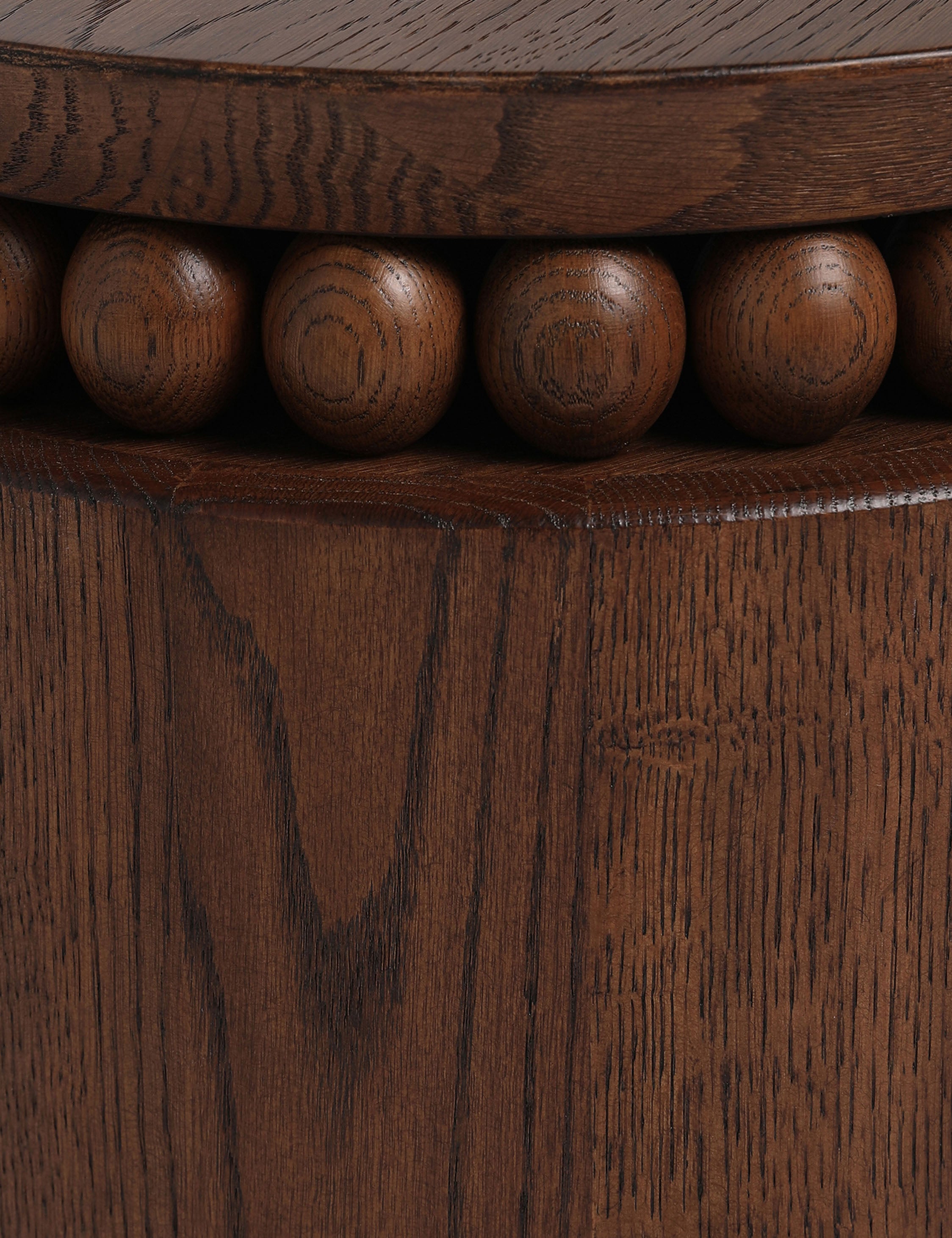 Close up of the Coco round drum beaded wood side table by Carly Cushnie.