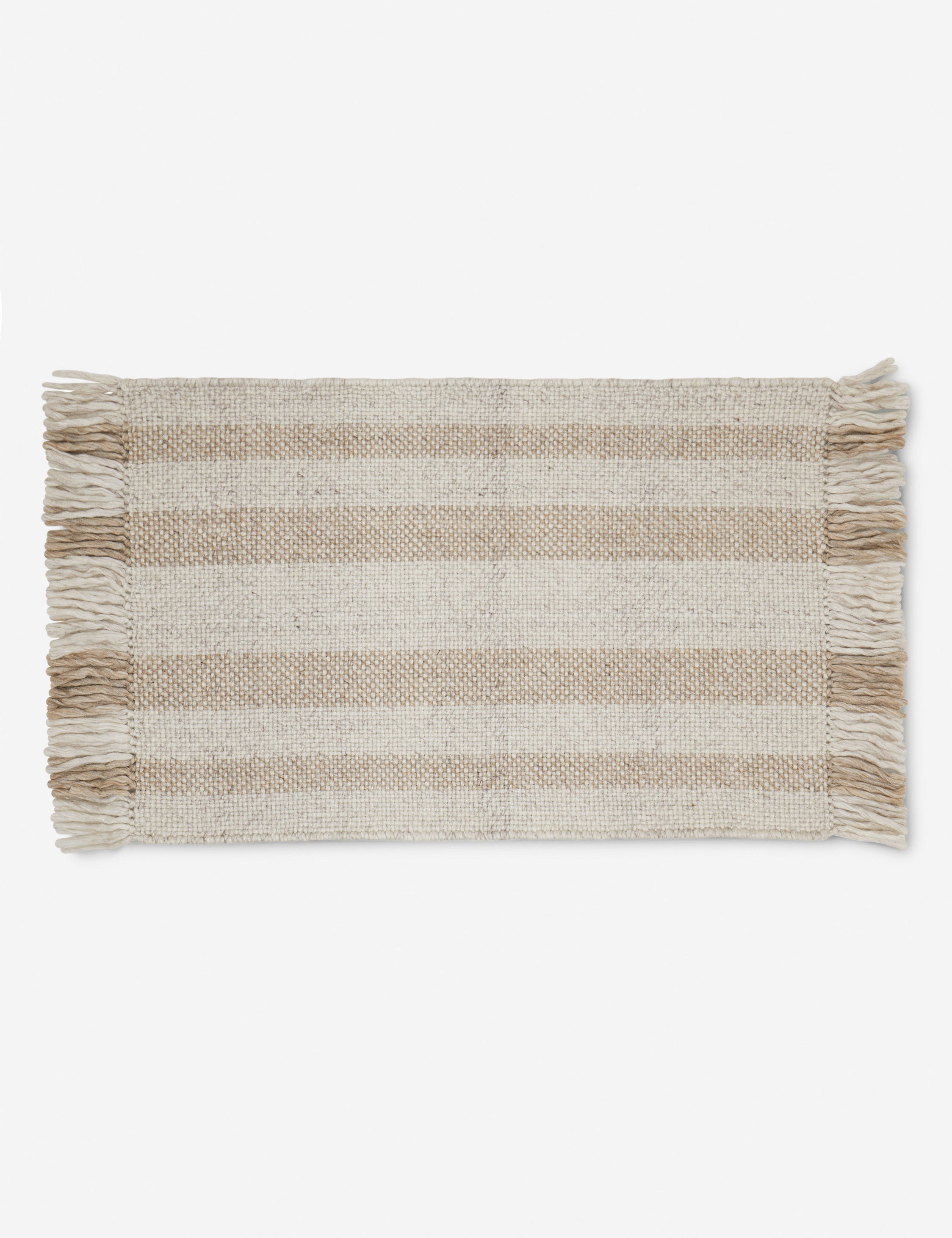 Small Croze handwoven striped fringed outdoor rug.