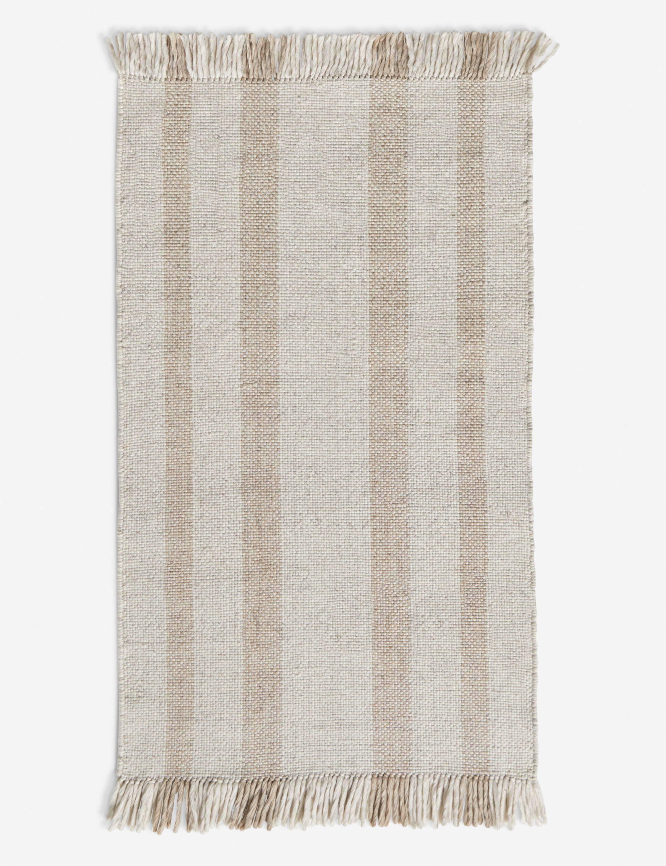 Small Croze handwoven striped fringed outdoor rug.