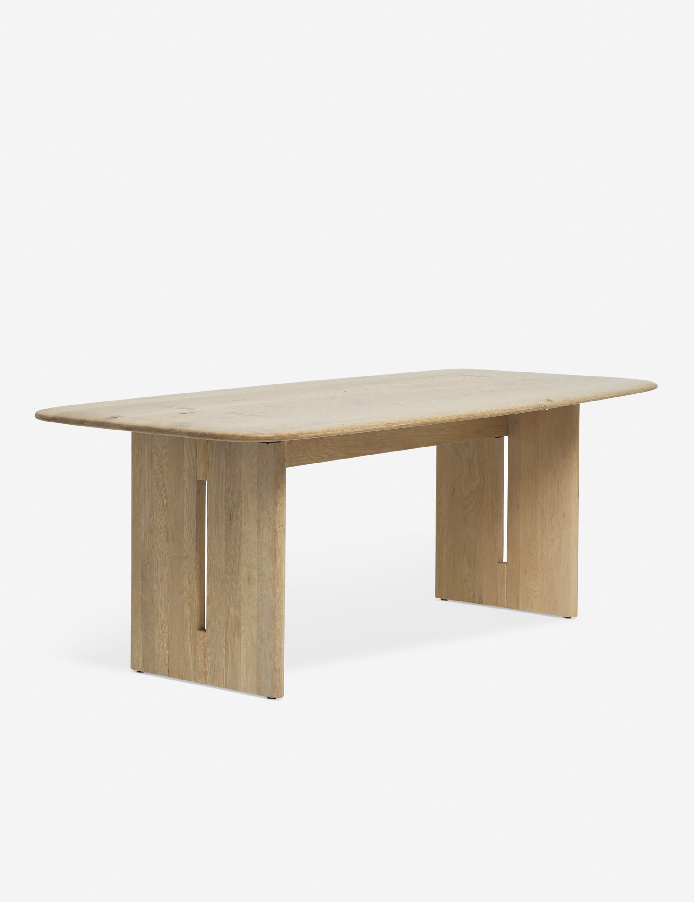 Henrik light wood six person rectangular dining table with visible joinery and rounded edges