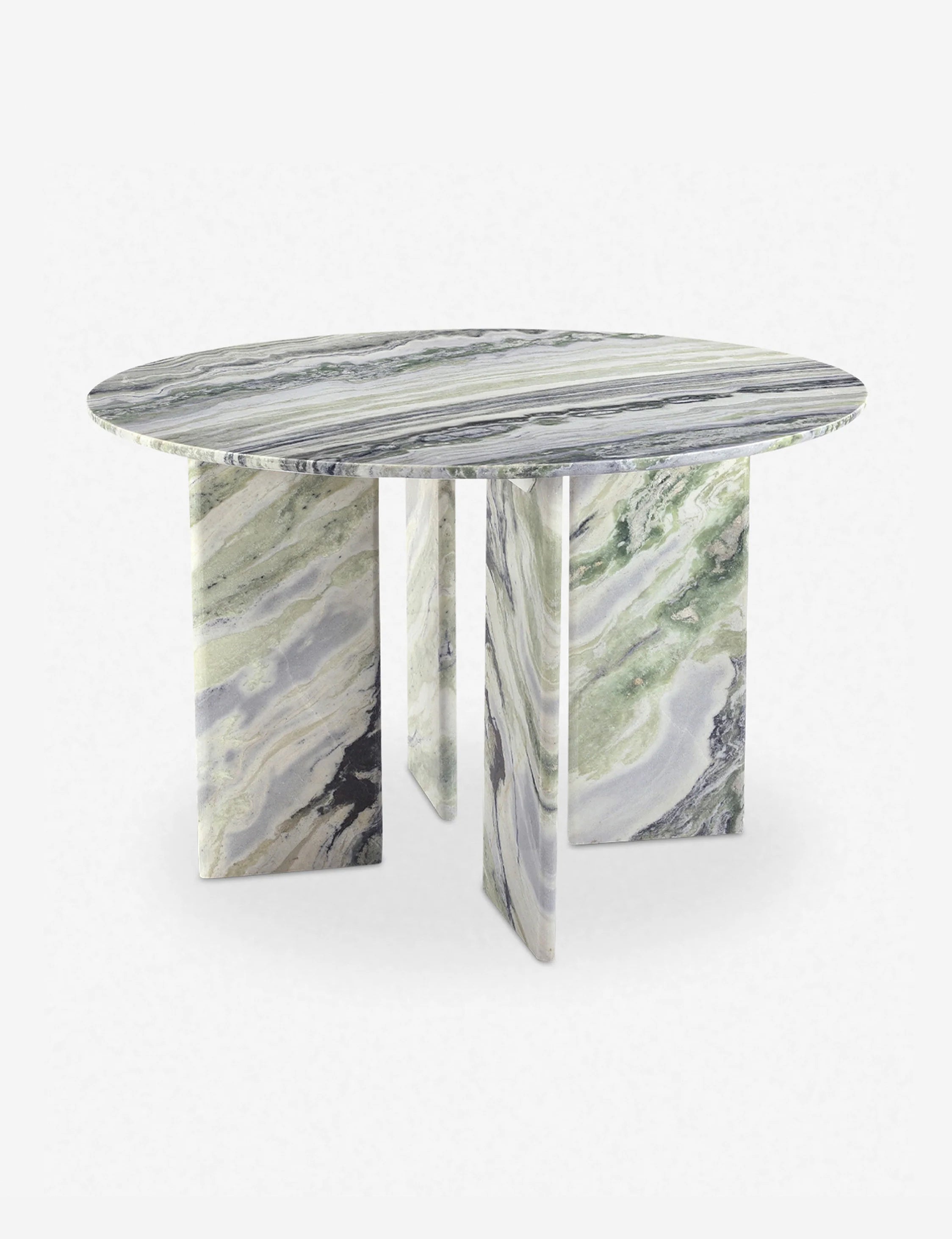 Angled view of the Celia sculptural round marble dining table.