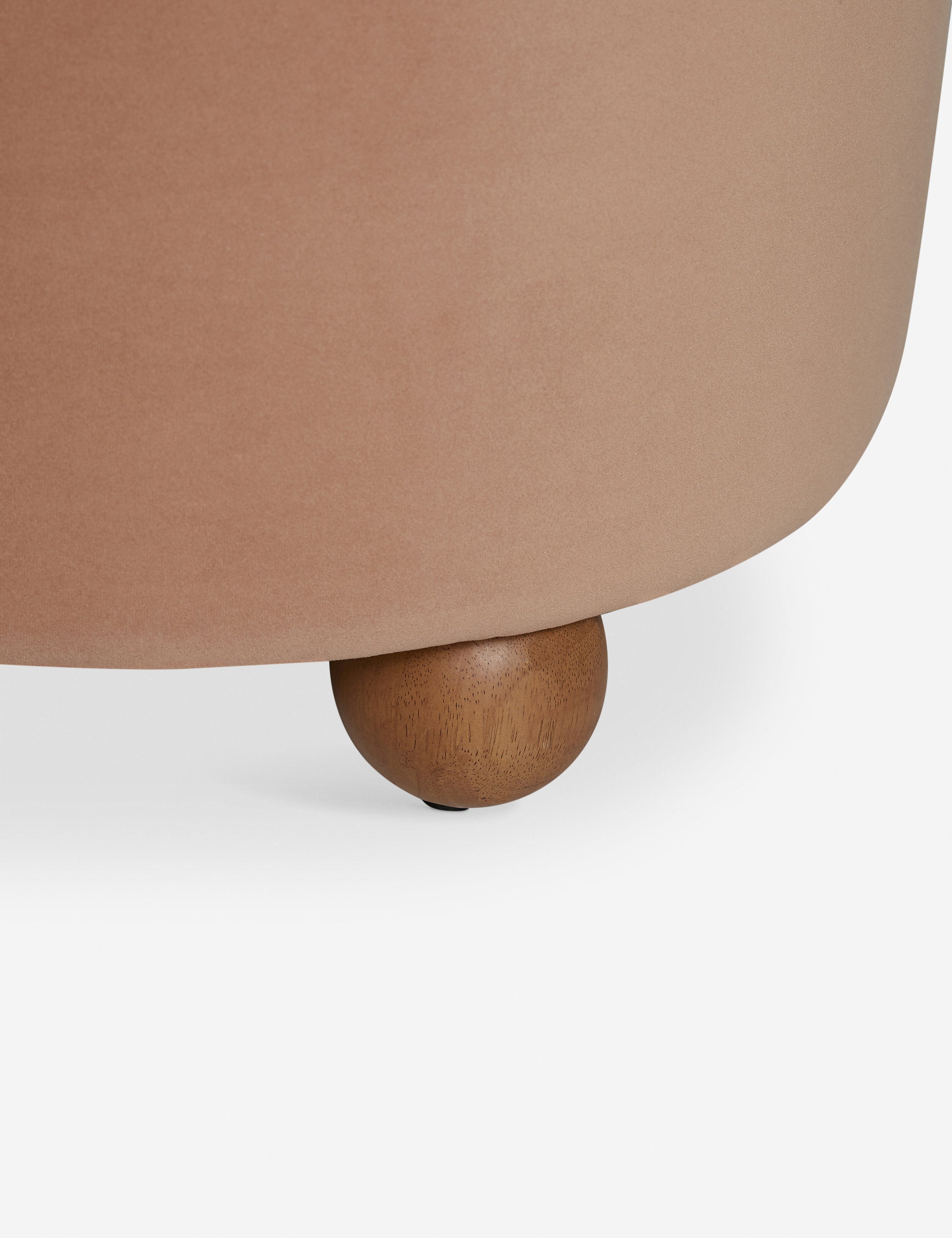 Wooden foot of the Judson modern round velvet dining chair.
