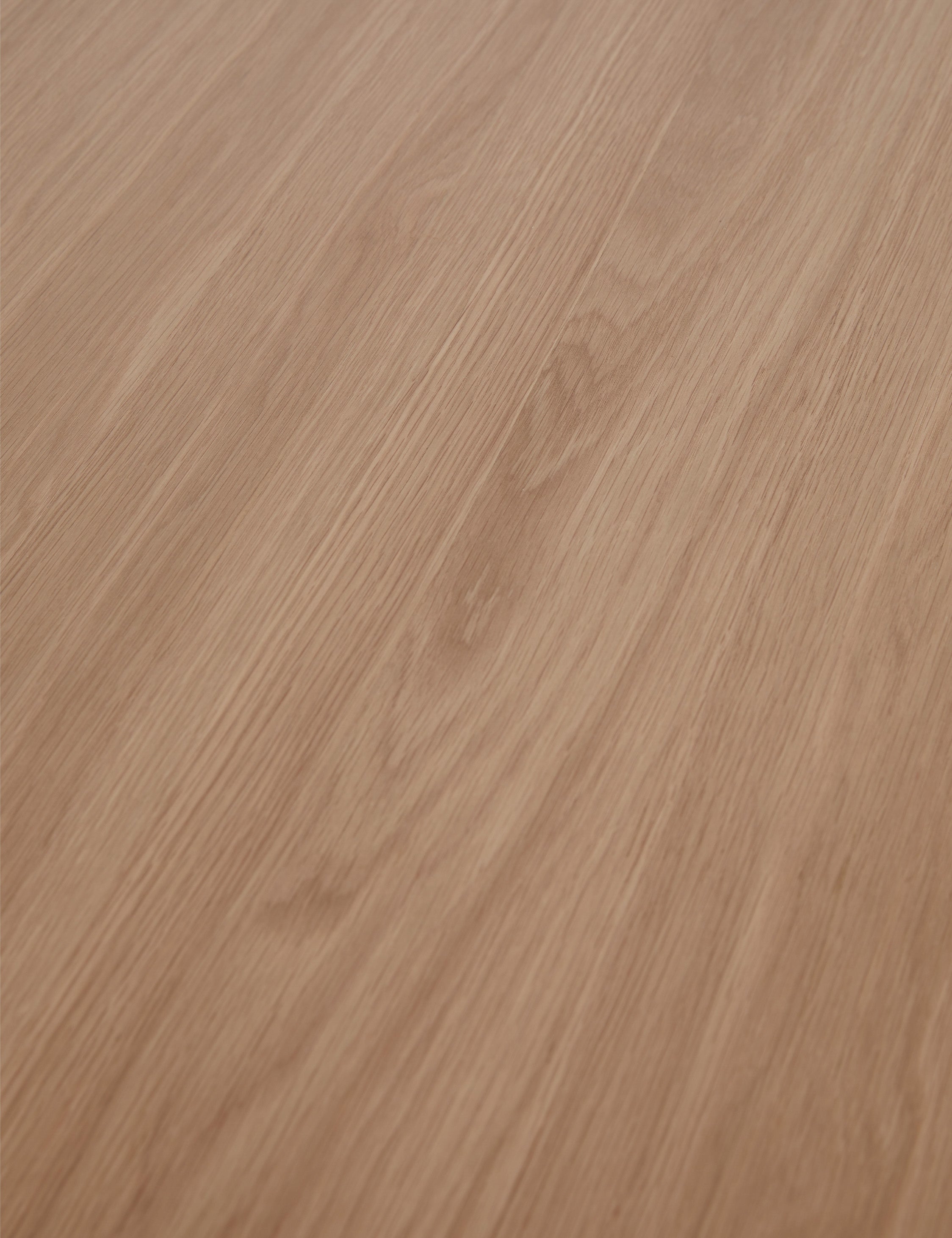 Close up view of the wood grain of the Karine round natural wood pedestal dining table