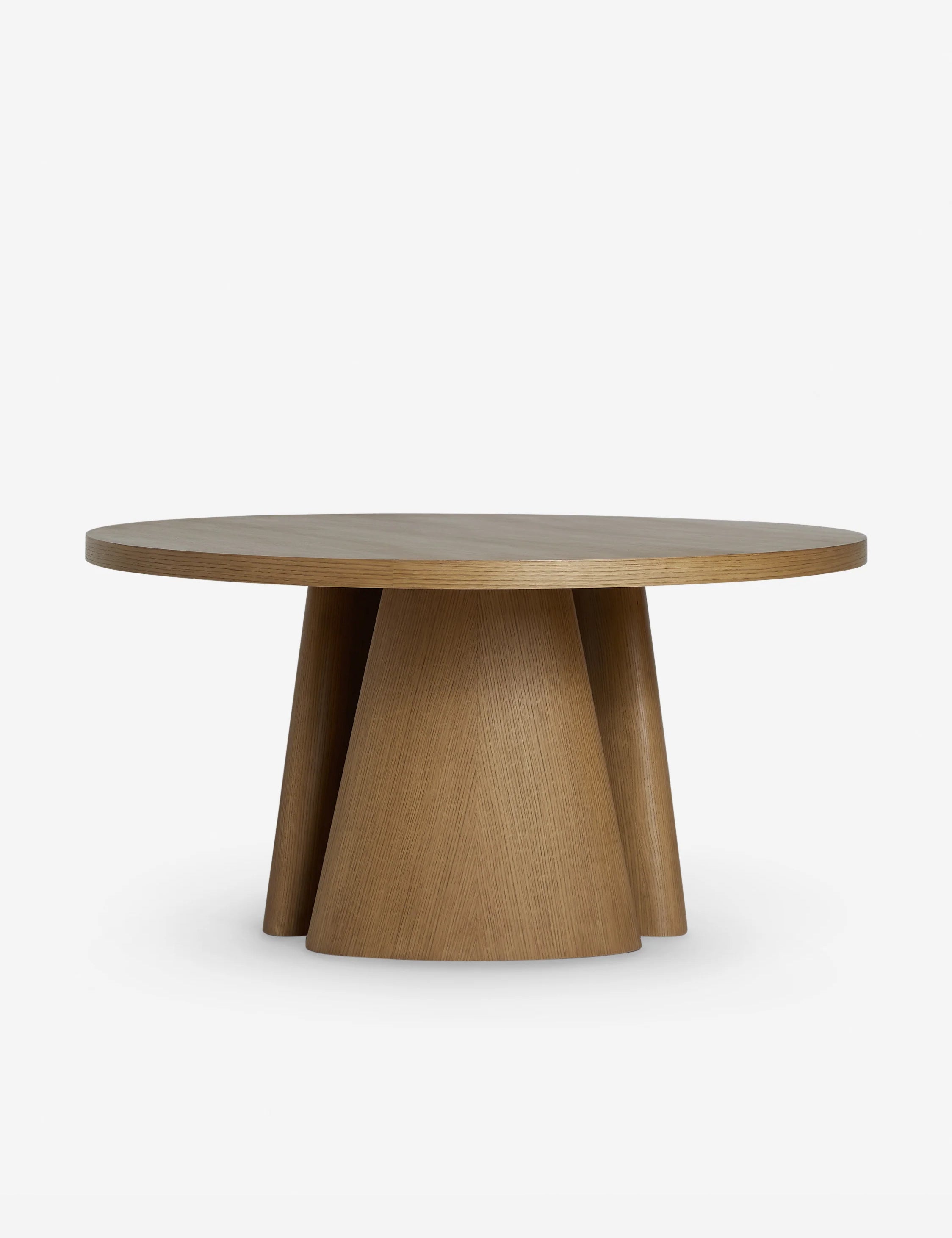 Keating round geometric wood pedestal dining table.