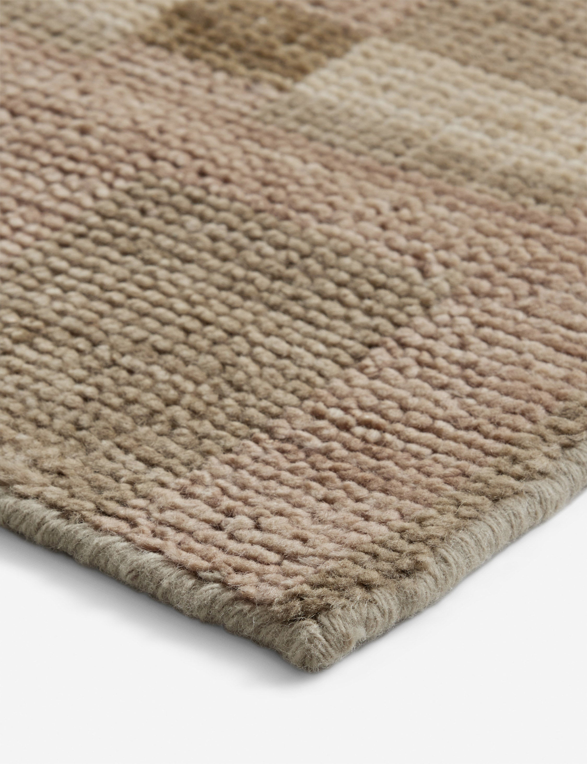 Close up of the corner of the Lalan hand-knotted geometric pattern wool rug.
