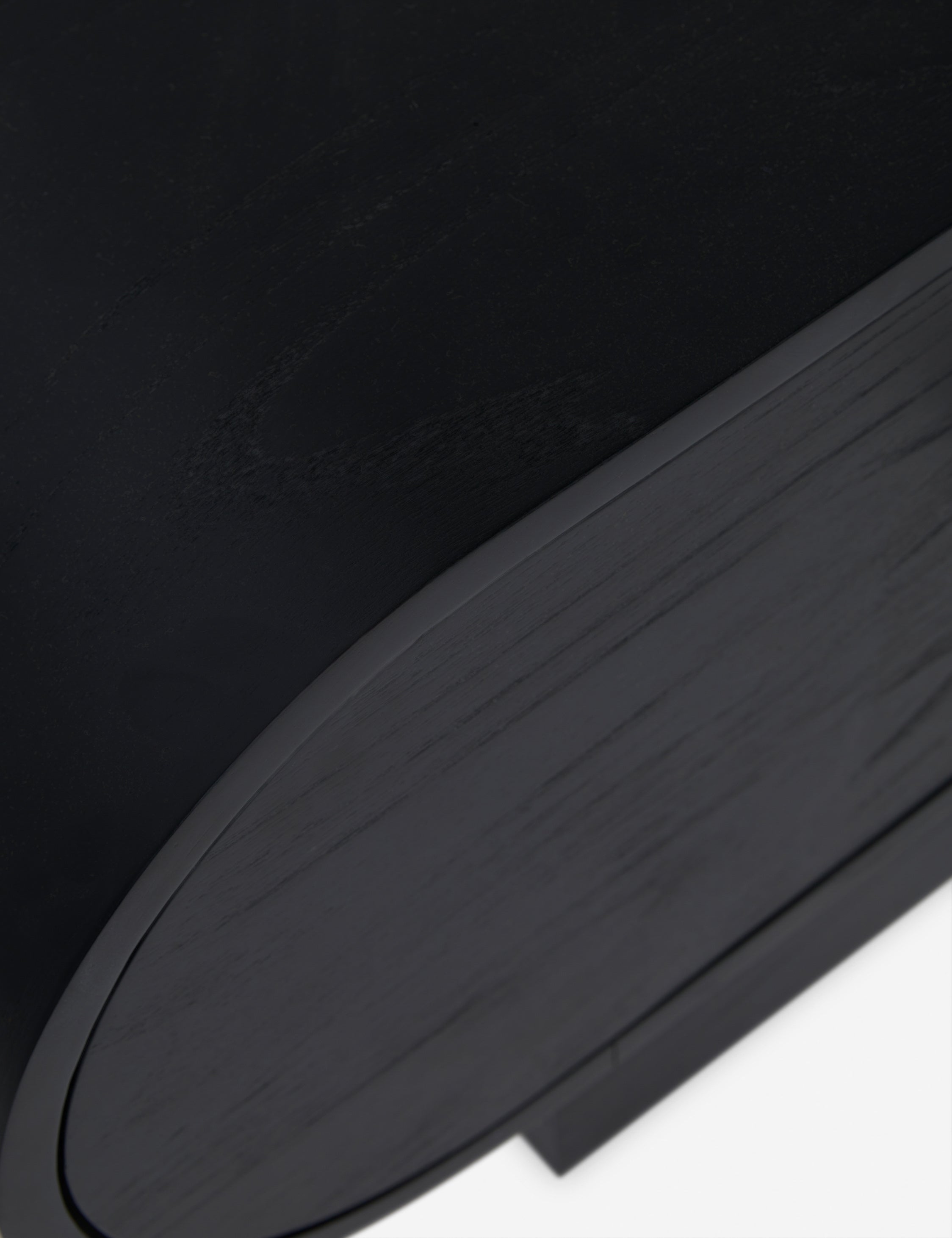 Close up view of the Laughlin retro pill shaped nightstand in black