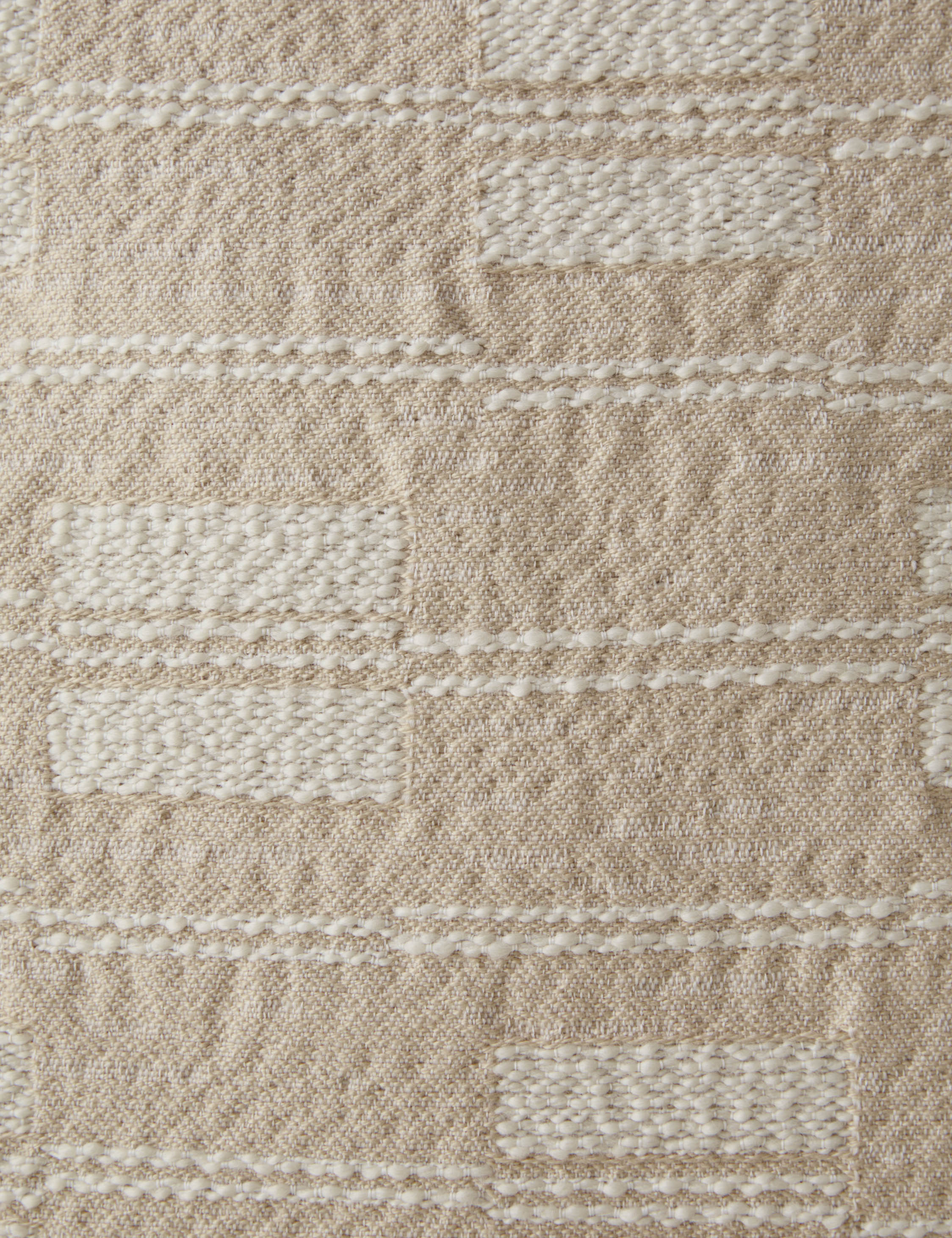 Close up of the Leighton broken stripe pillow in natural.