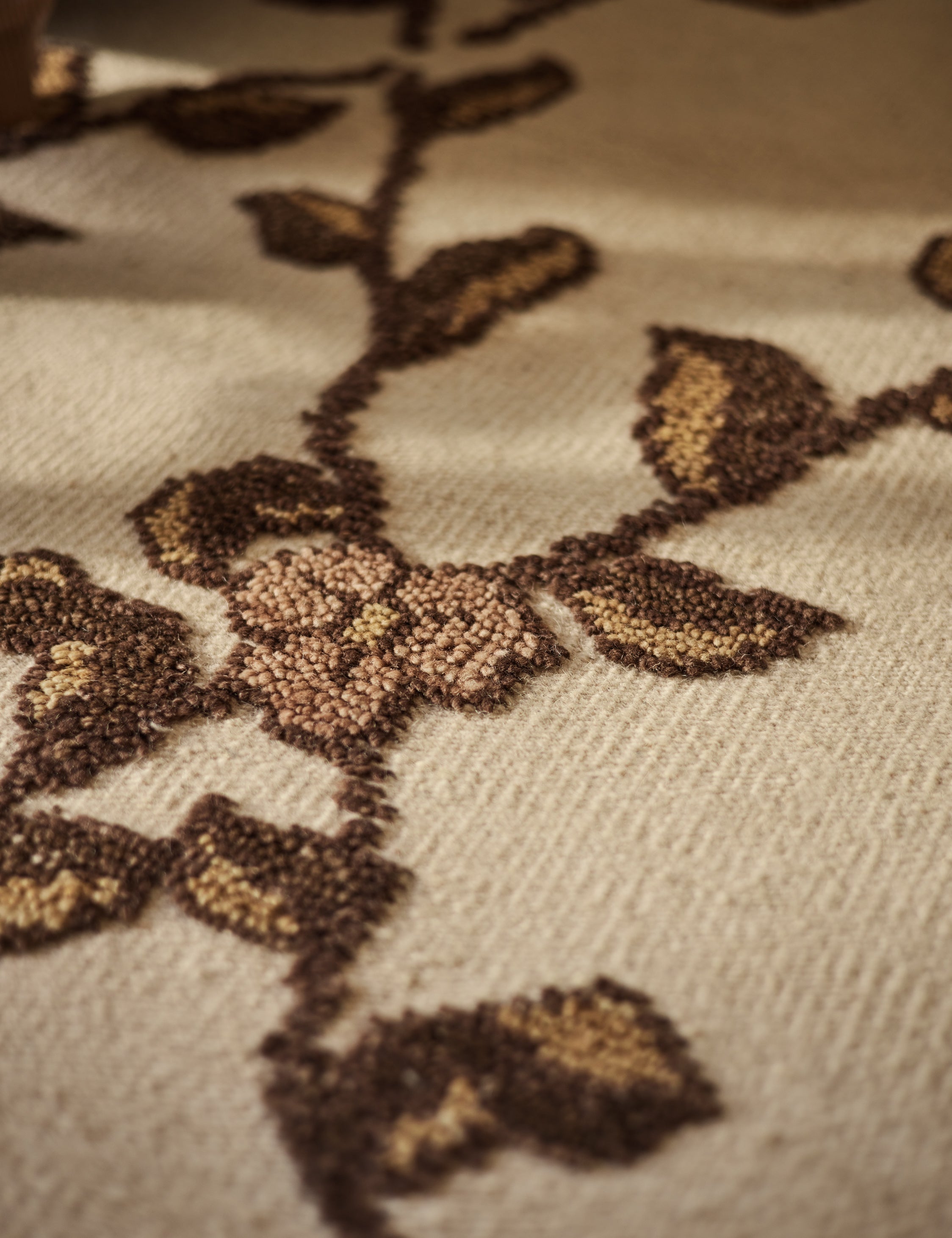 Close up of the design of the Tillar Hand-Knotted Botanical Lattice Wool Rug by Jake Arnold