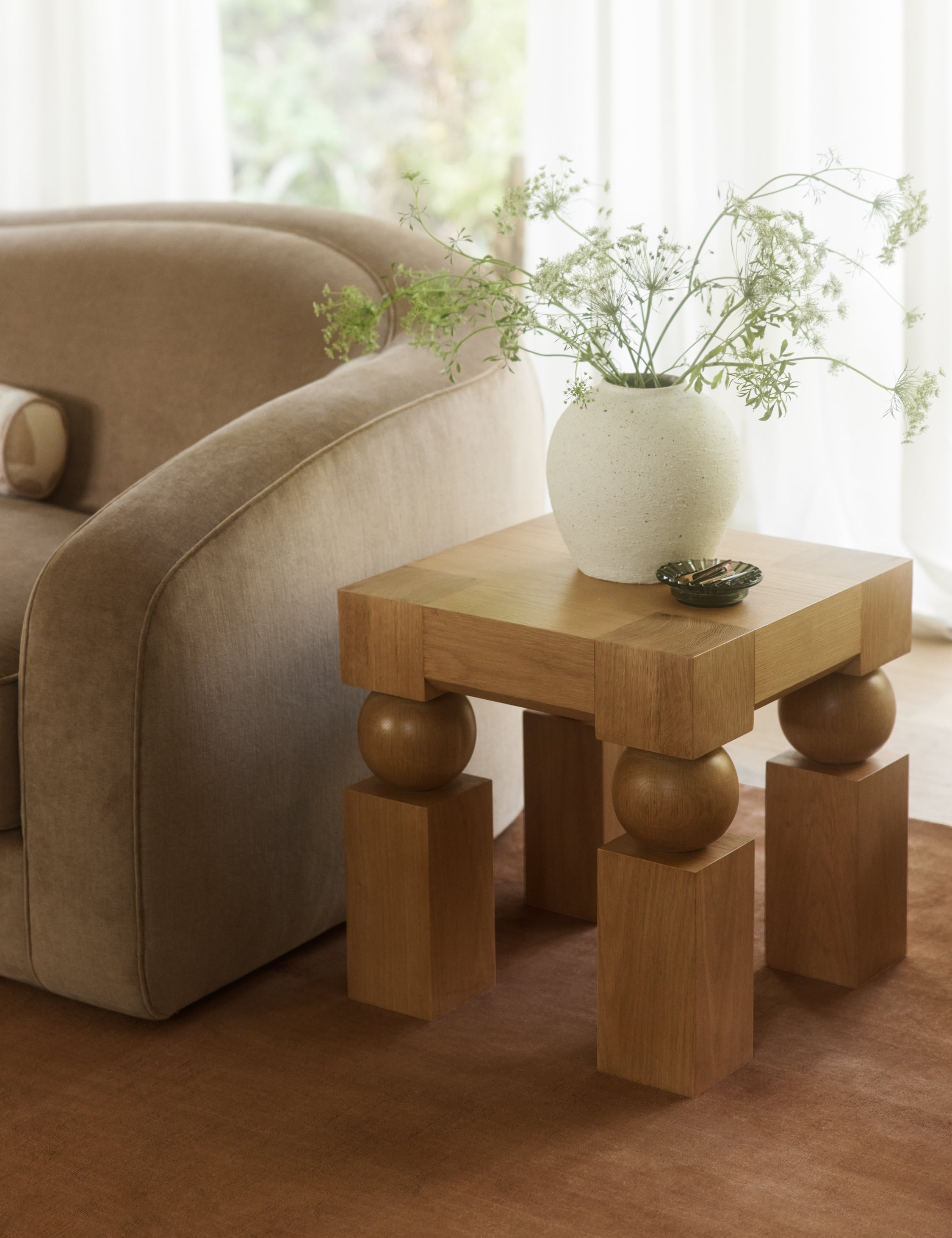 Living room featuring the Kent sculptural modern square side table.