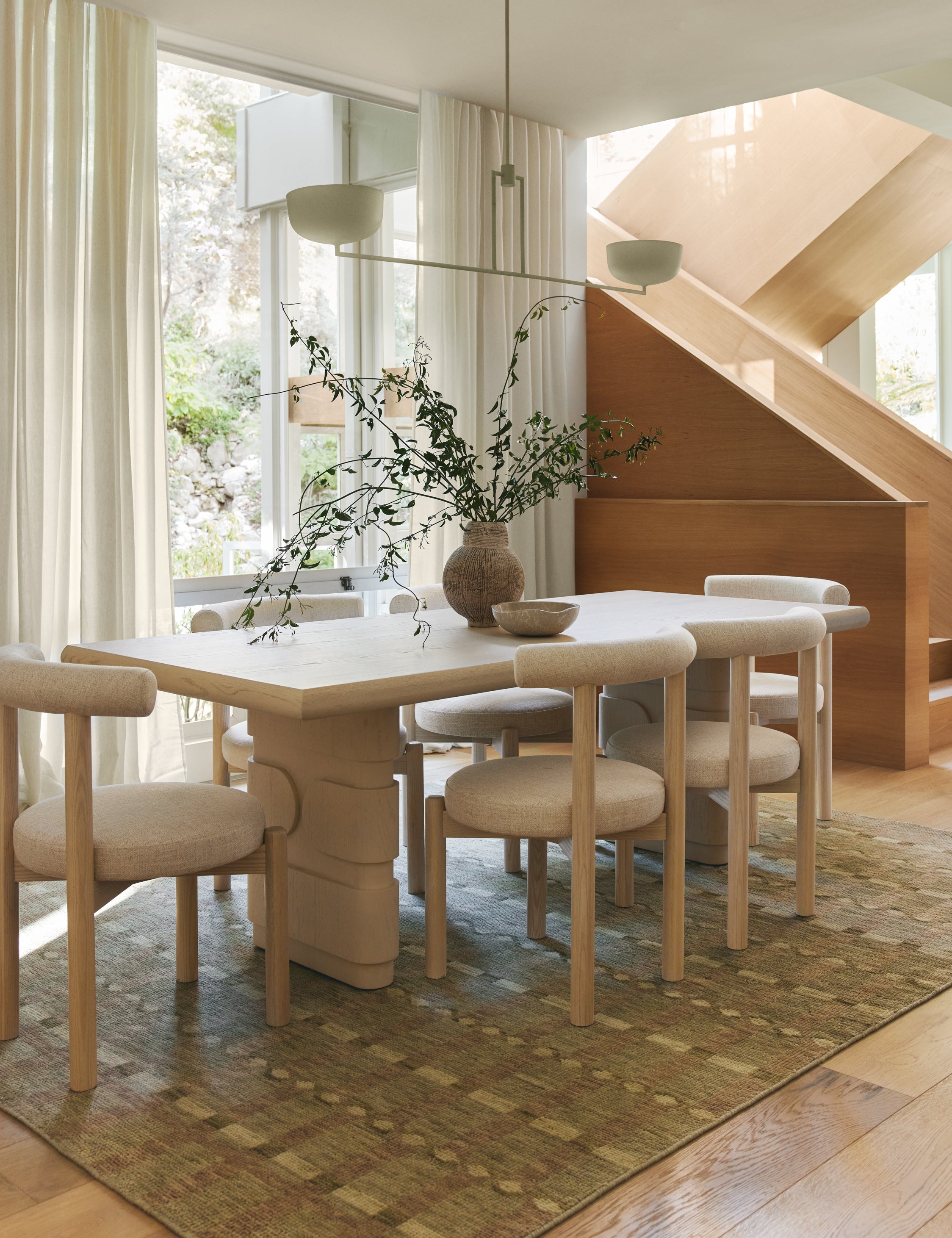 Dining room featuring the Lowen double pedestal base white washed dining table.