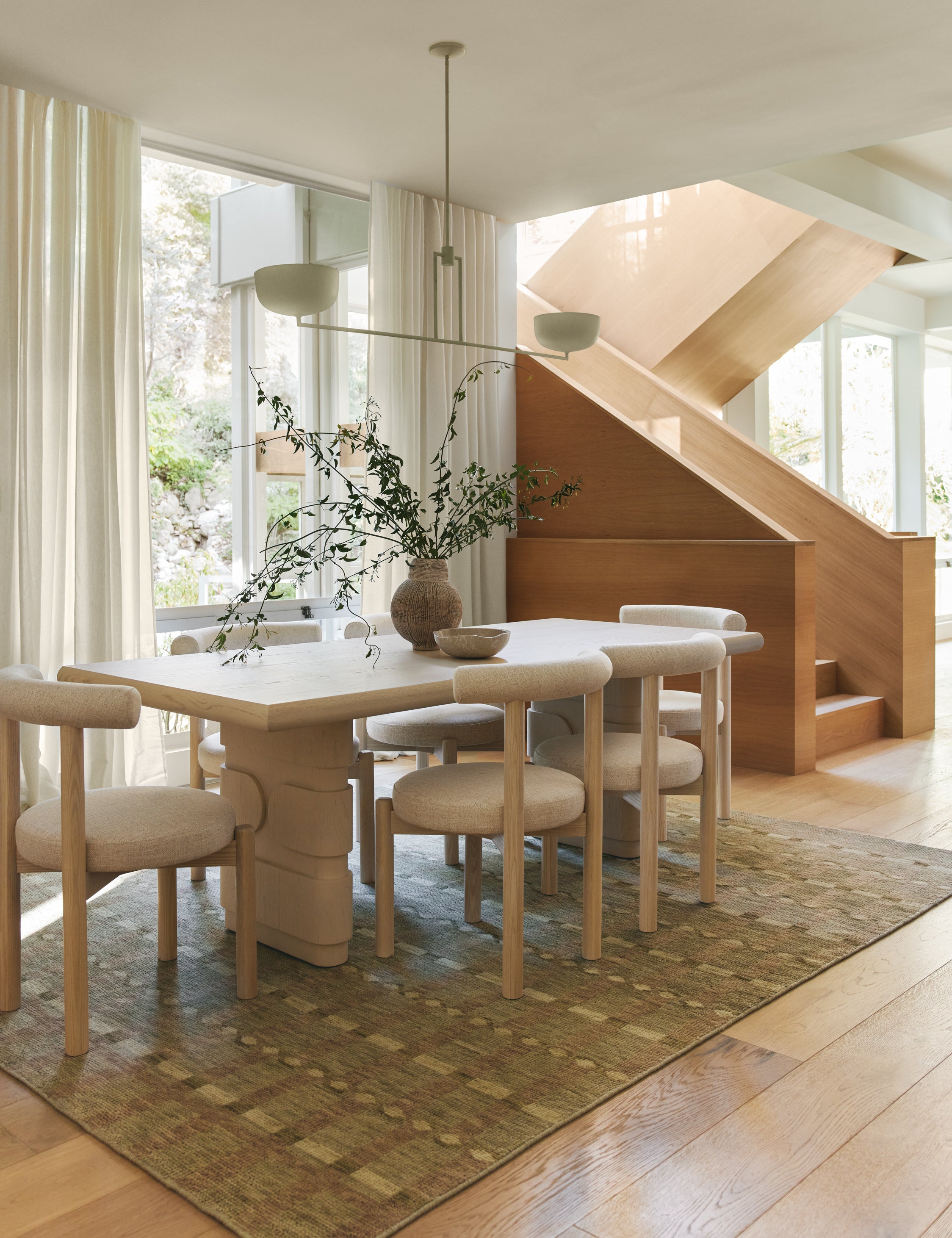 Dining room featuring the Lalan hand-knotted geometric pattern wool rug.