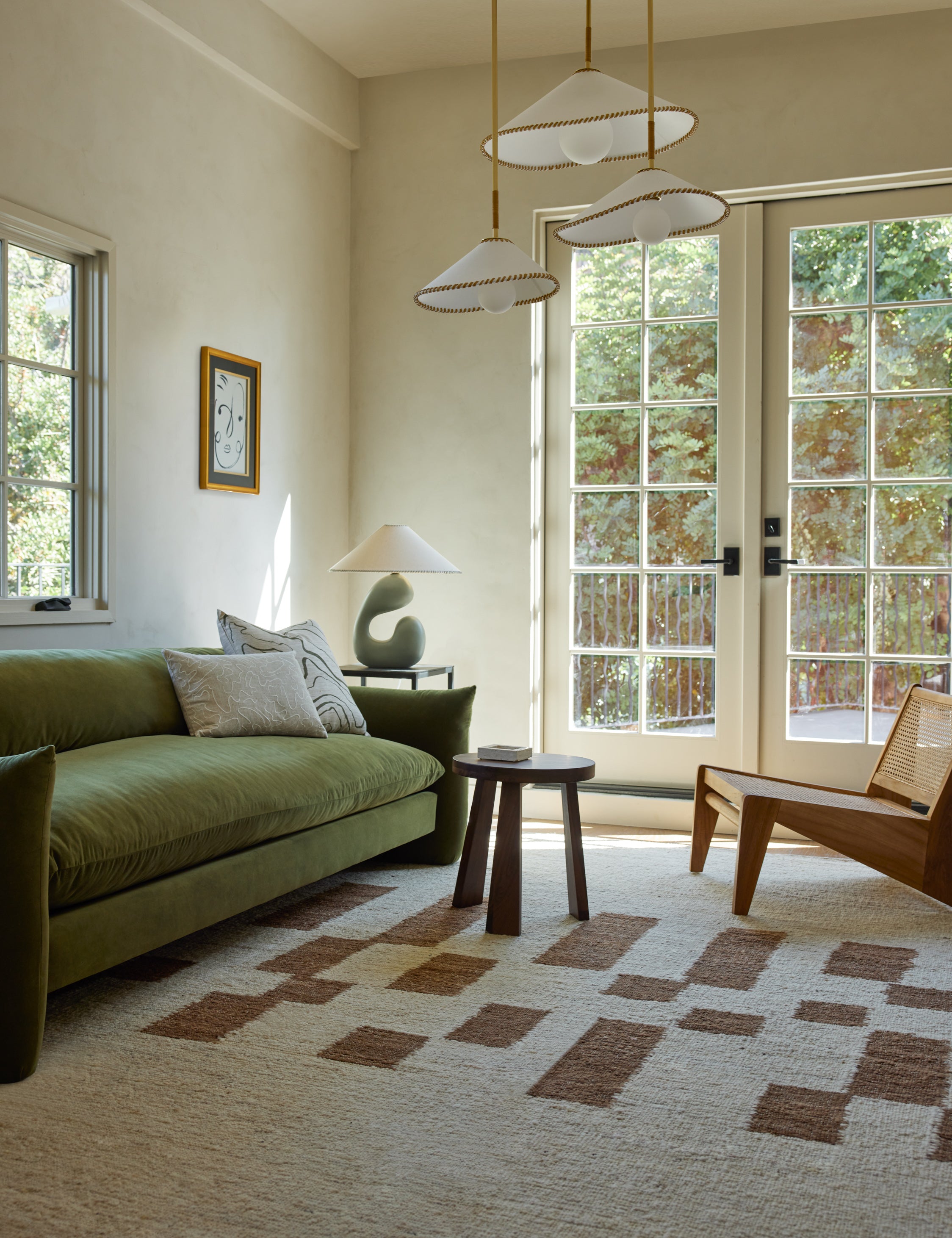 Mosaic Handwoven Wool Rug by Elan Byrd styled in a living room.