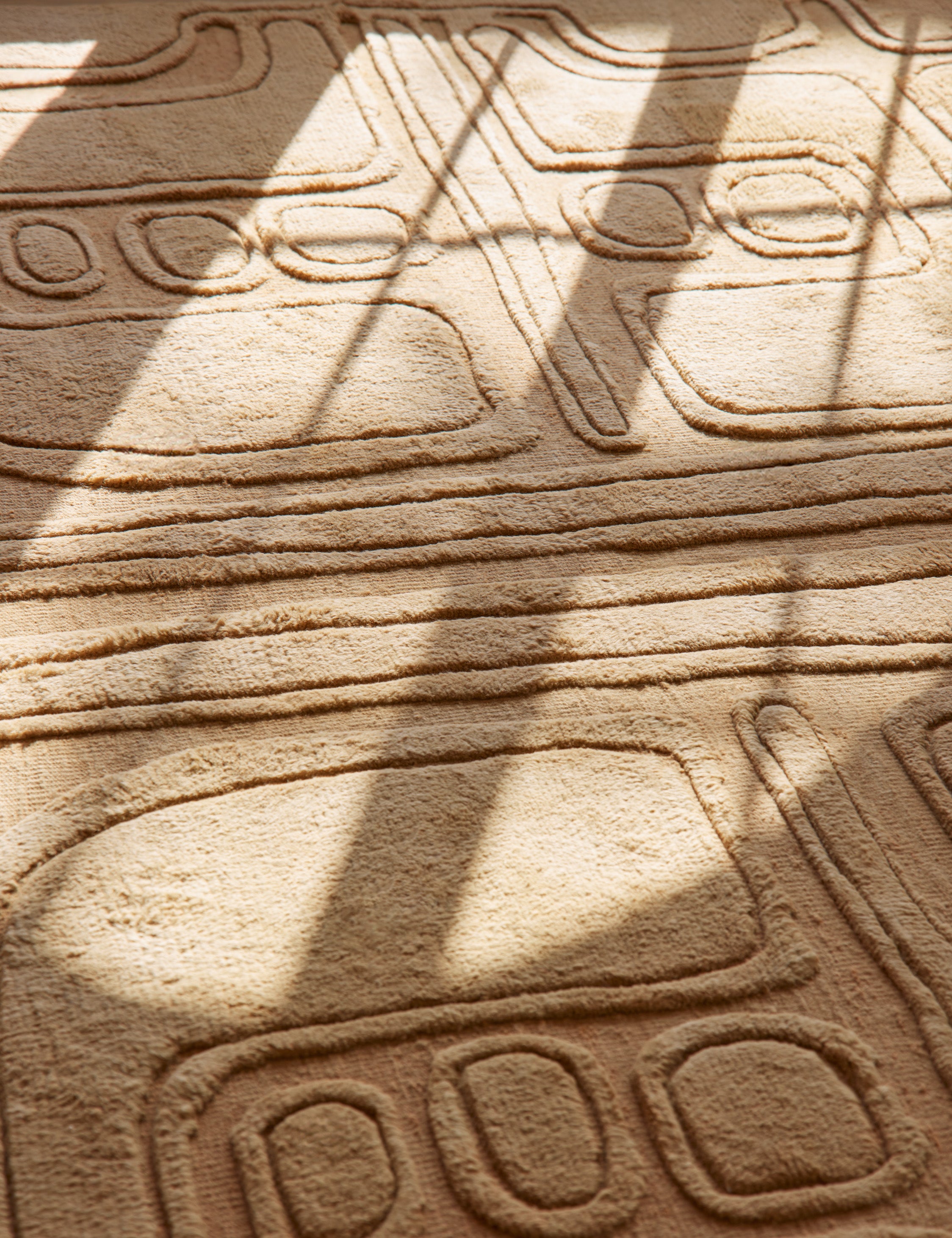 Close up of the Bosa abstract design hand-knotted wool rug.