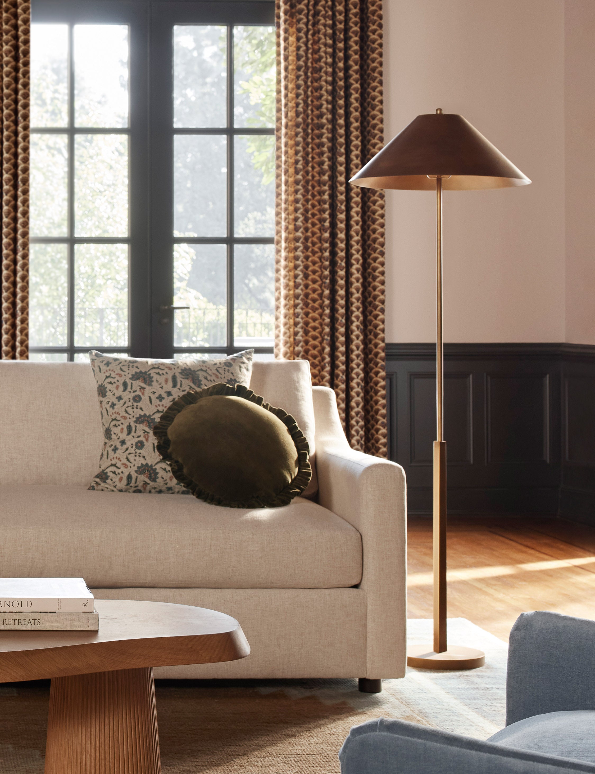 Tutton tapered metal shade floor lamp styled beside a sofa
