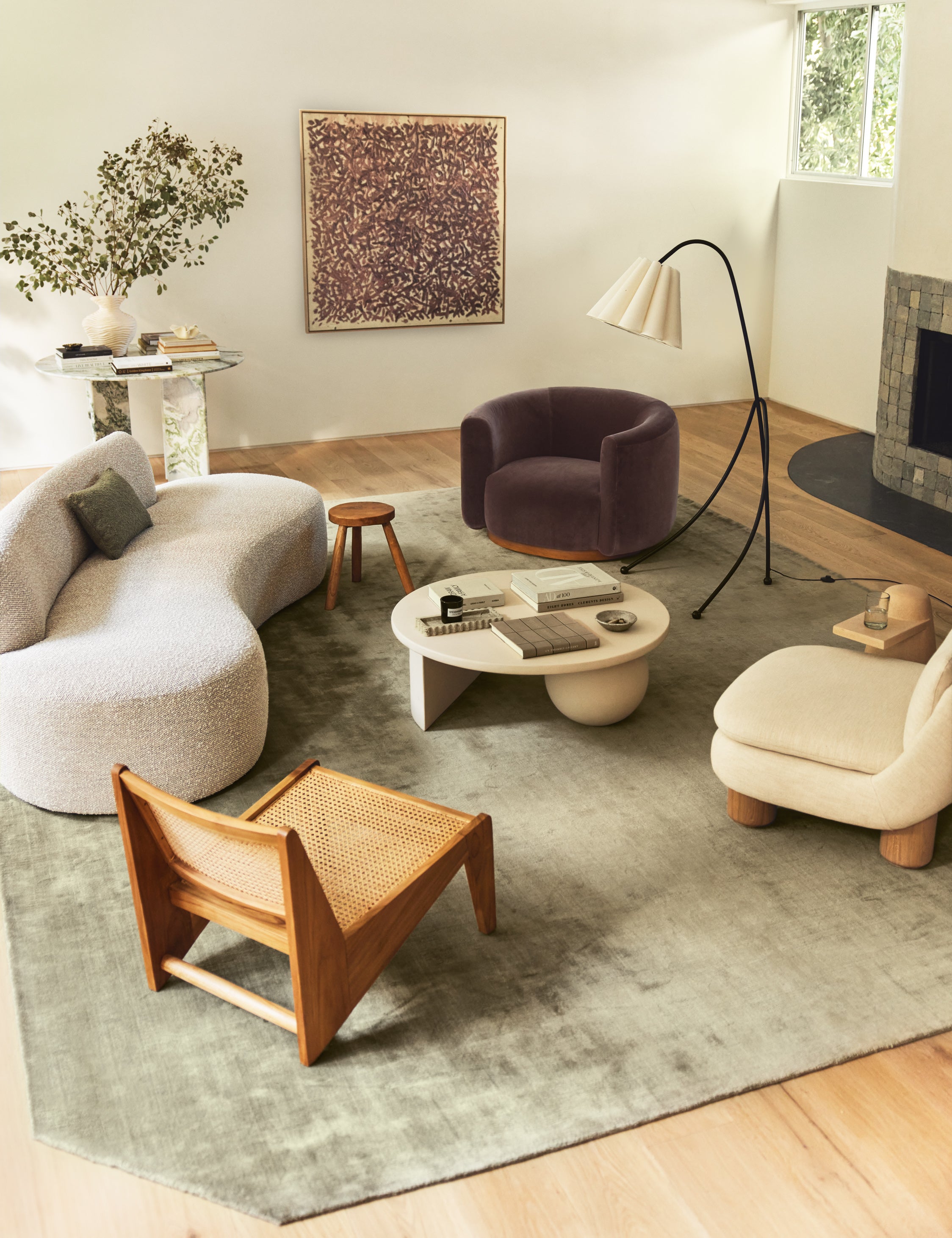 Living room featuring the Damara solid viscose rug in sage.
