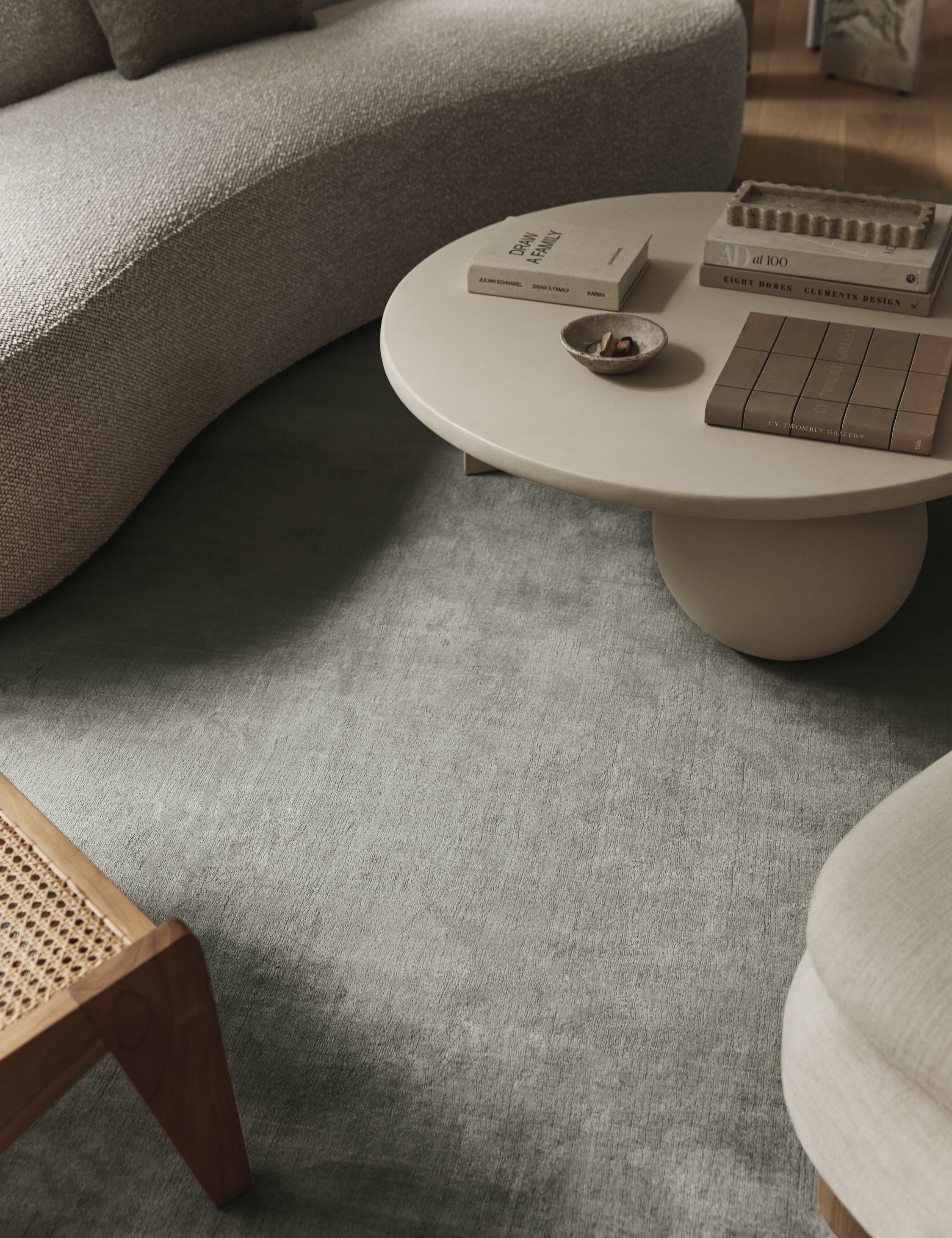Living room featuring the Damara solid viscose rug in sage.