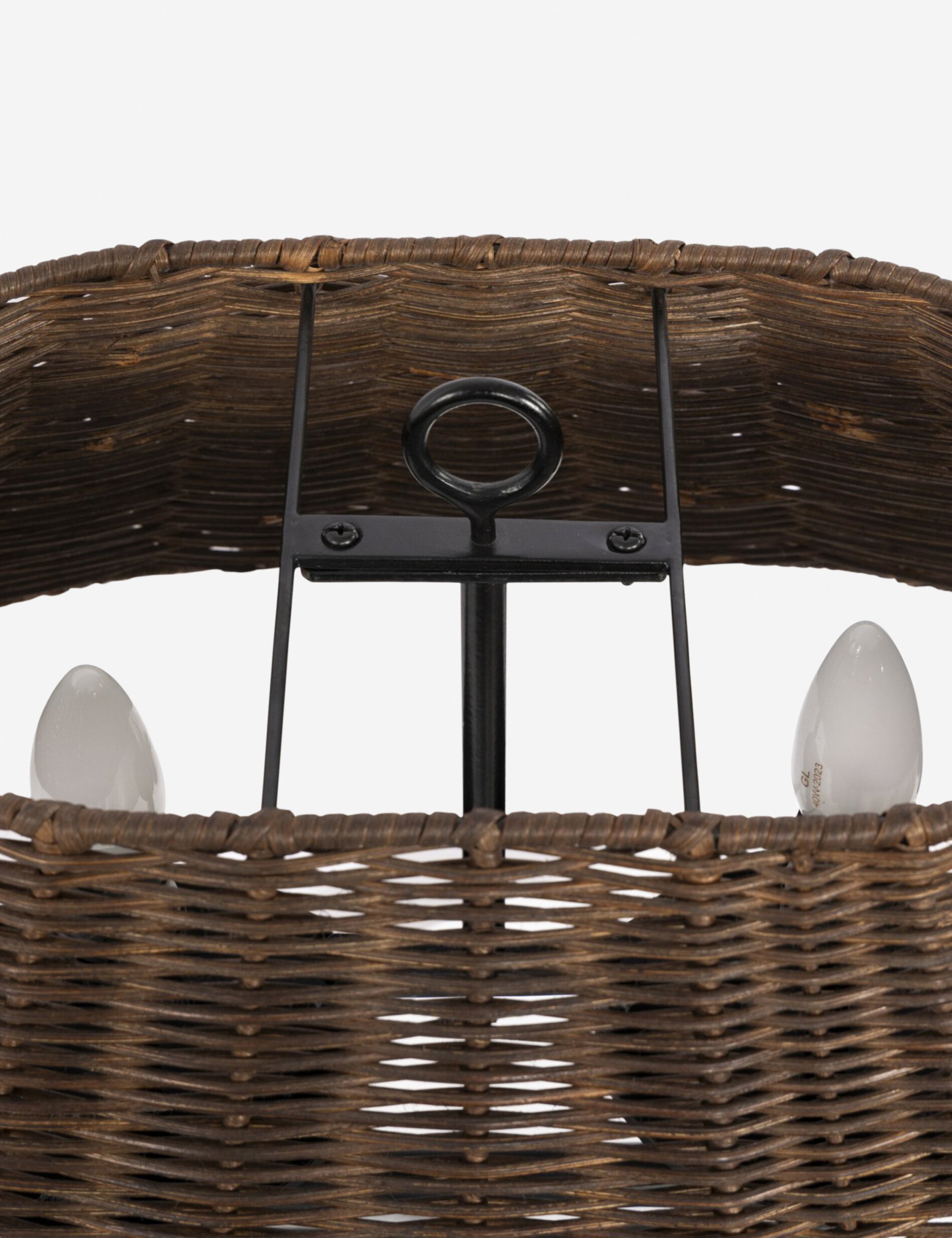 Close up of the Teulon basketweave wicker double-post table lamp