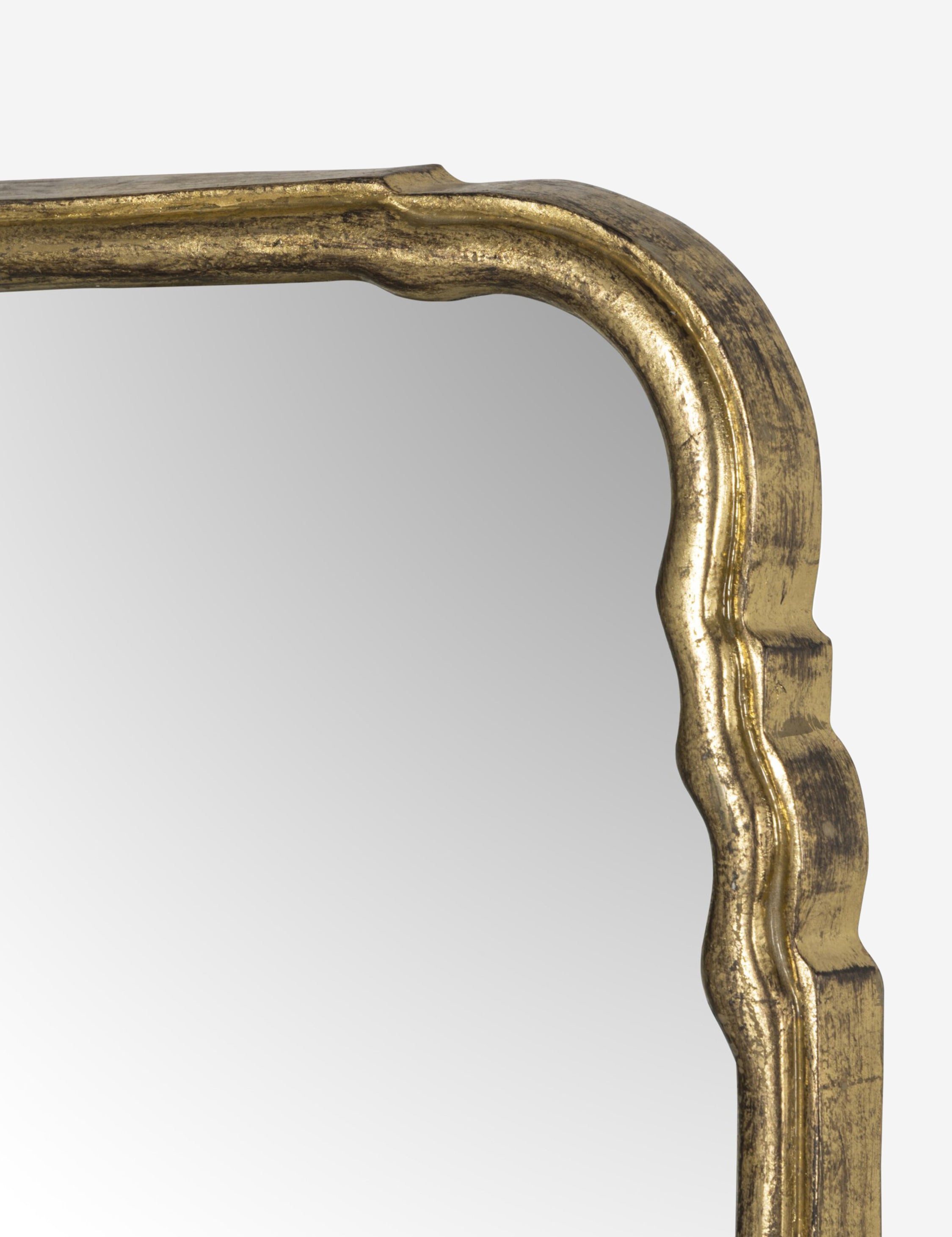 Close up of the frame of the Coudray serpentine gold leaf frame mantel mirror