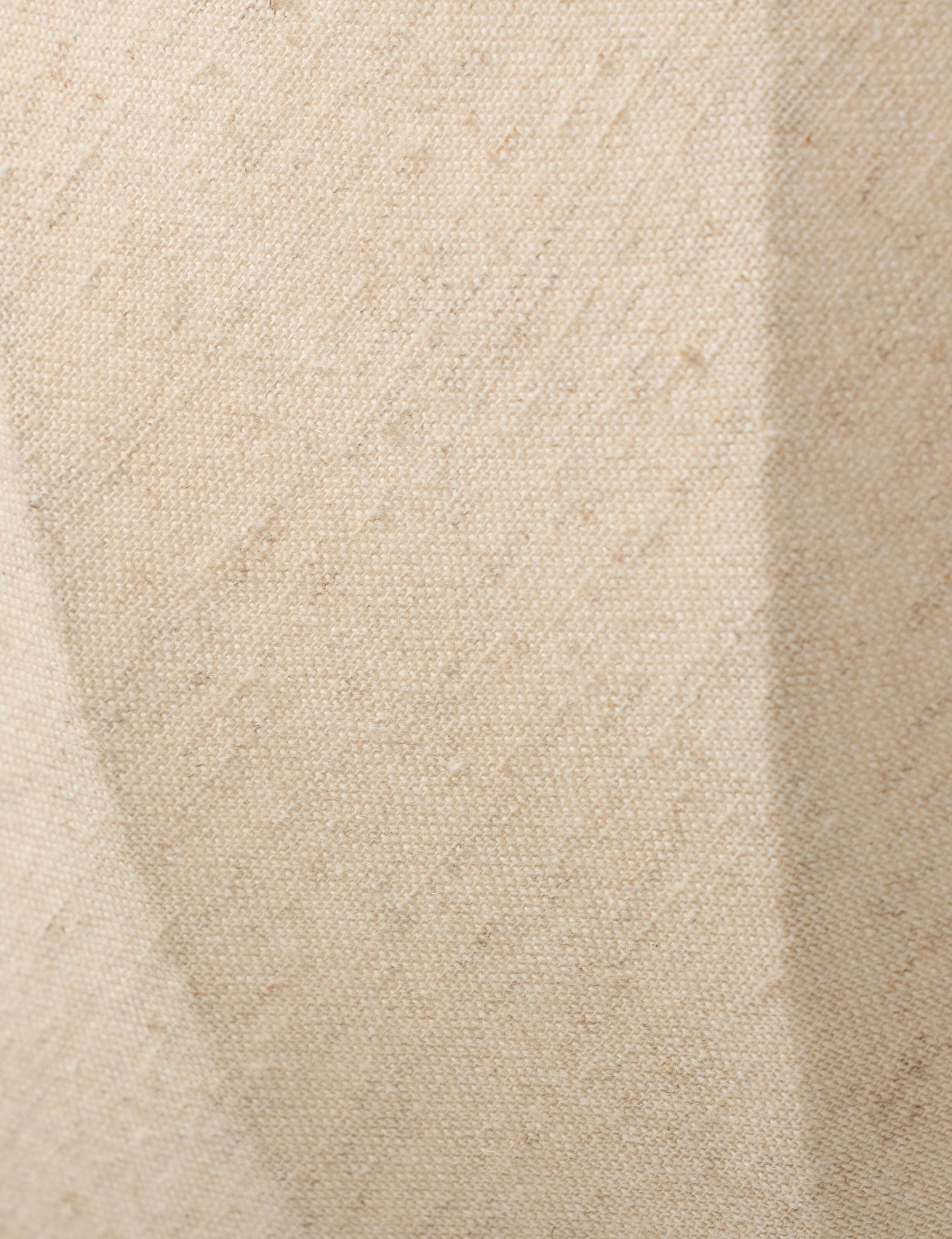 Close up of the Mahan linen up-ight wall sconce