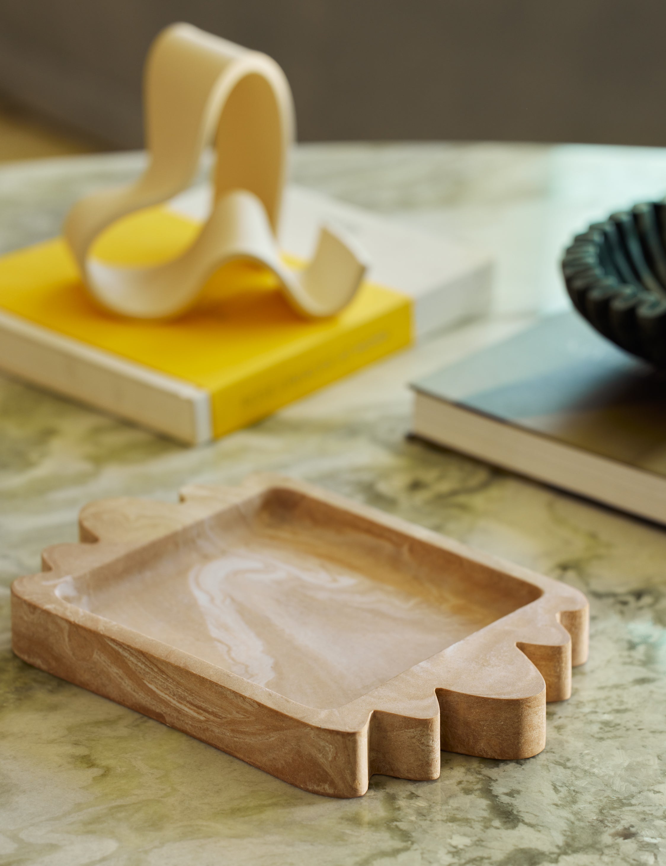 Melona resin decorative tray styled on a coffee table.