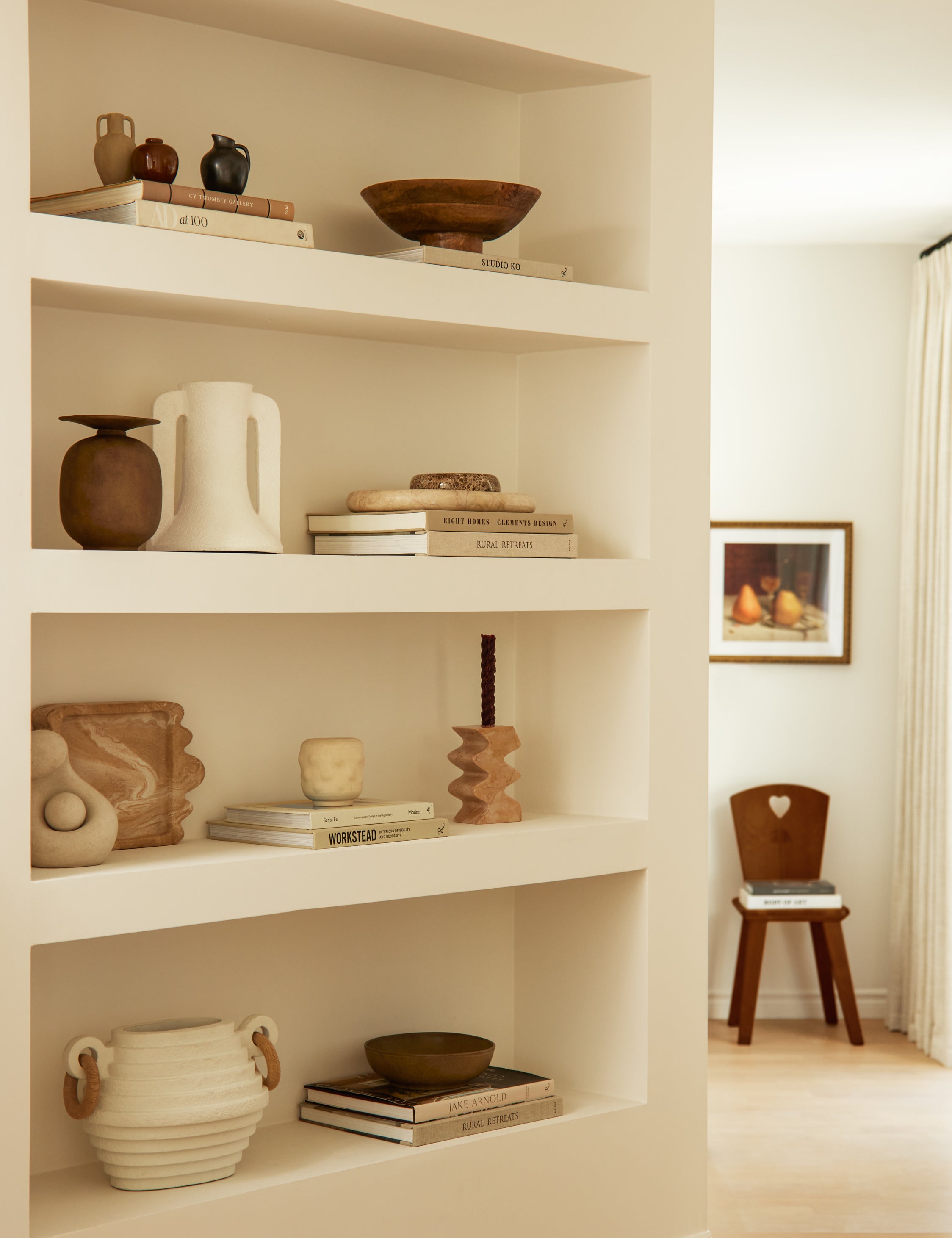 Nessa modern textured decorative vase styled on a built in bookshelf.