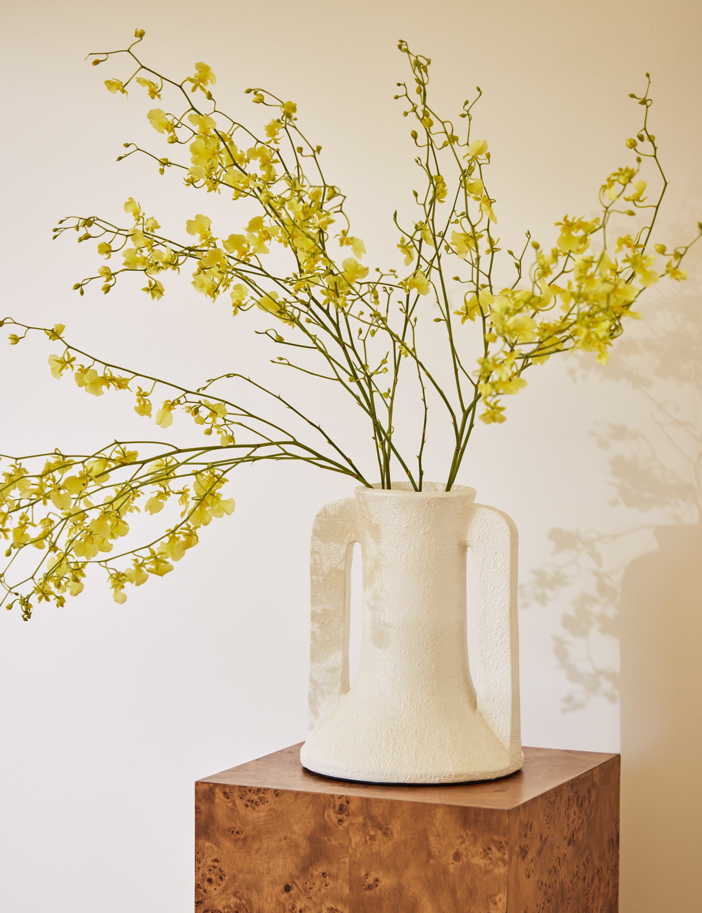 Nessa modern textured decorative vase on a pedestal.
