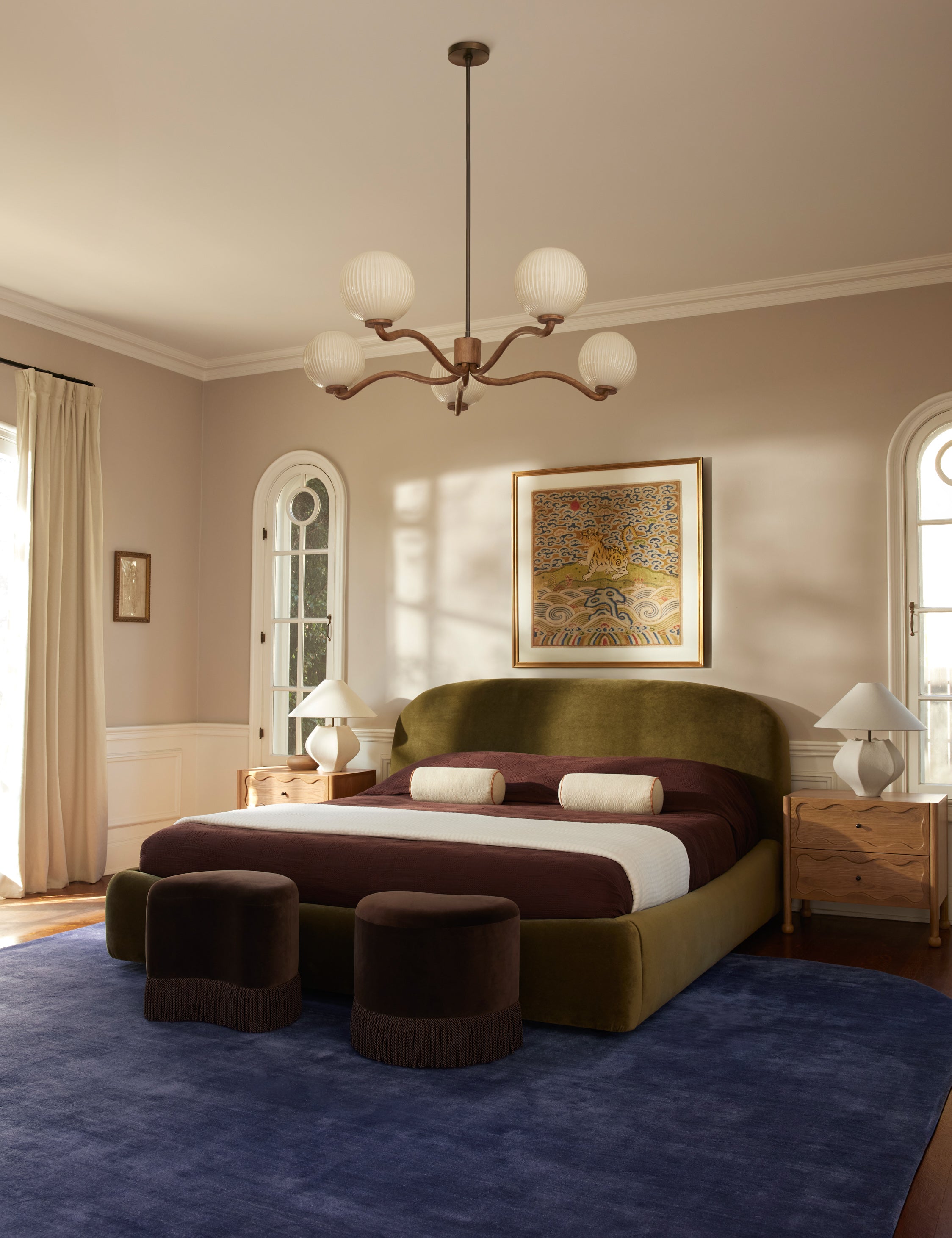 Nara fluted glass 5-globe chandelier by Aimee Song hanging in a bedroom