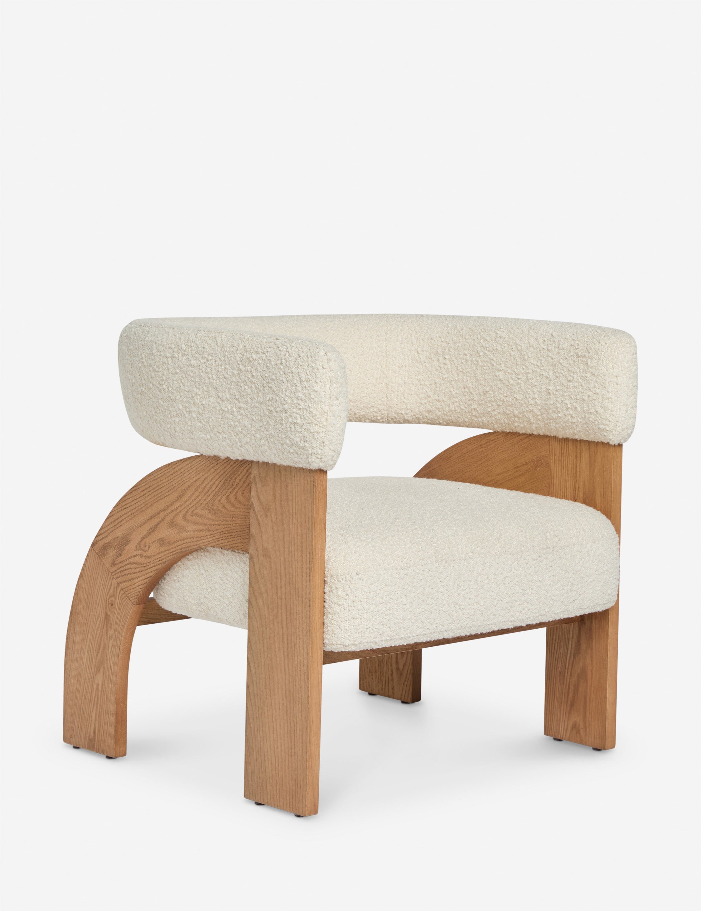 Angled view of the Agacia barrel back boucle upholstered accent chair by Aimee Song