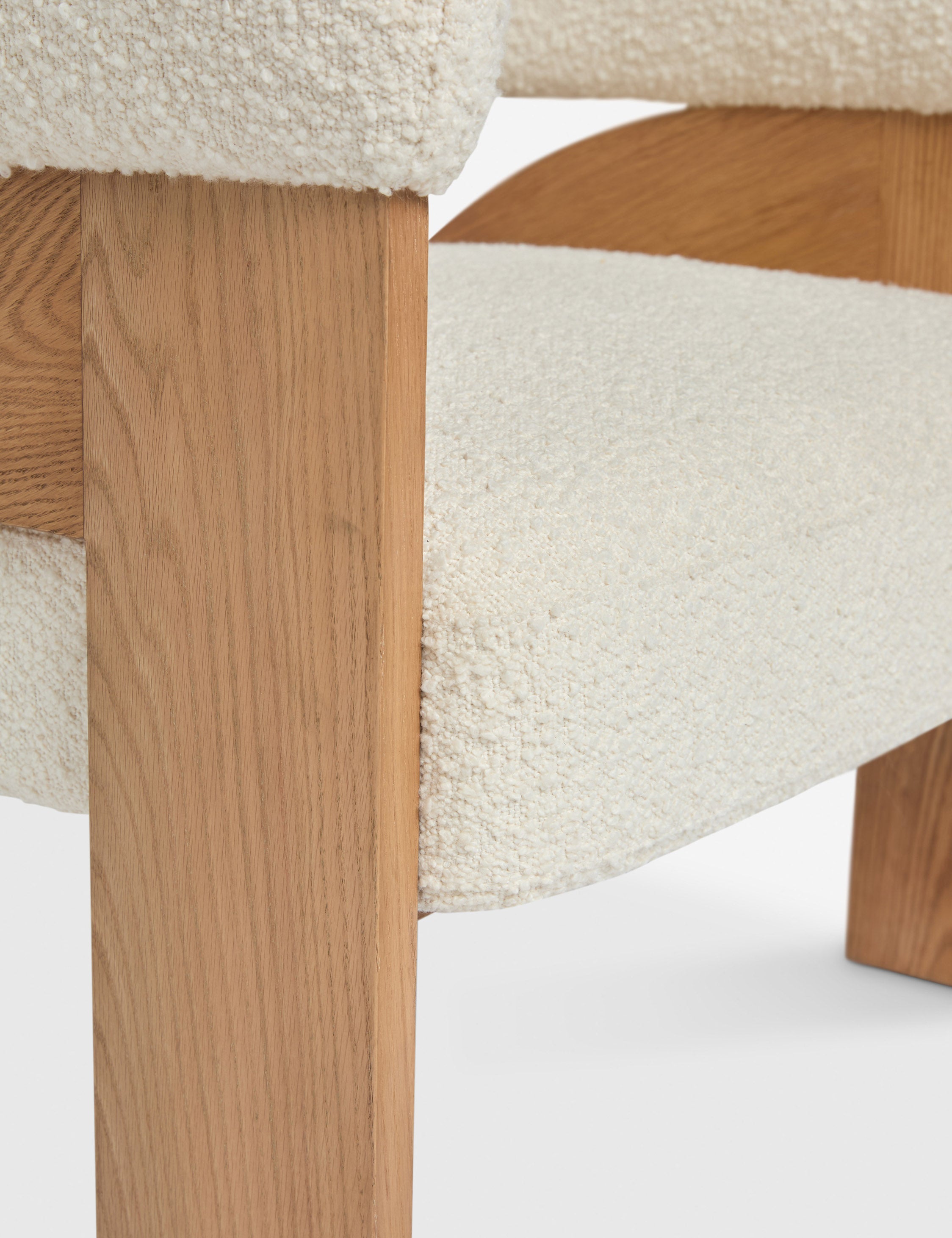 Close up view of the Agacia barrel back boucle upholstered accent chair by Aimee Song